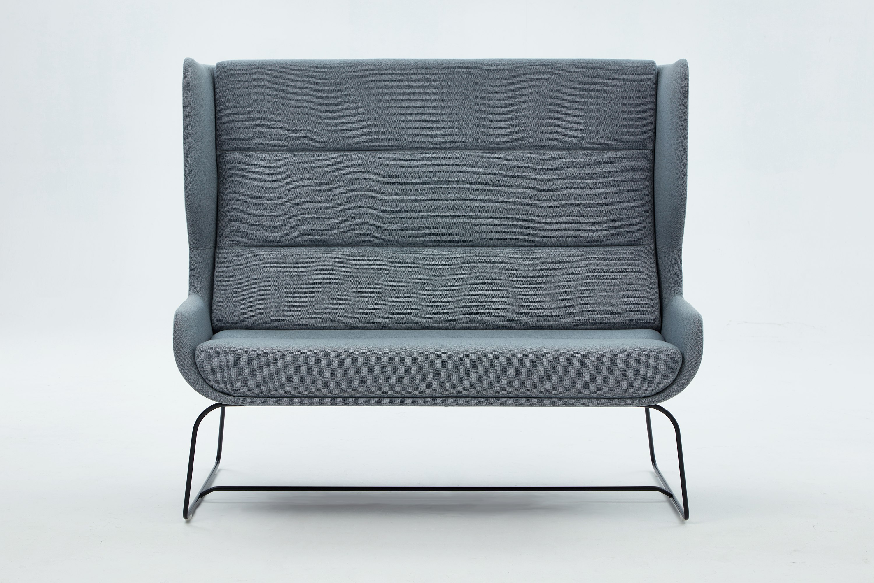 White sweep shot of grey Hush Sofa with black sled base.