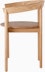 Profile view of an oak Comma Chair with arms.