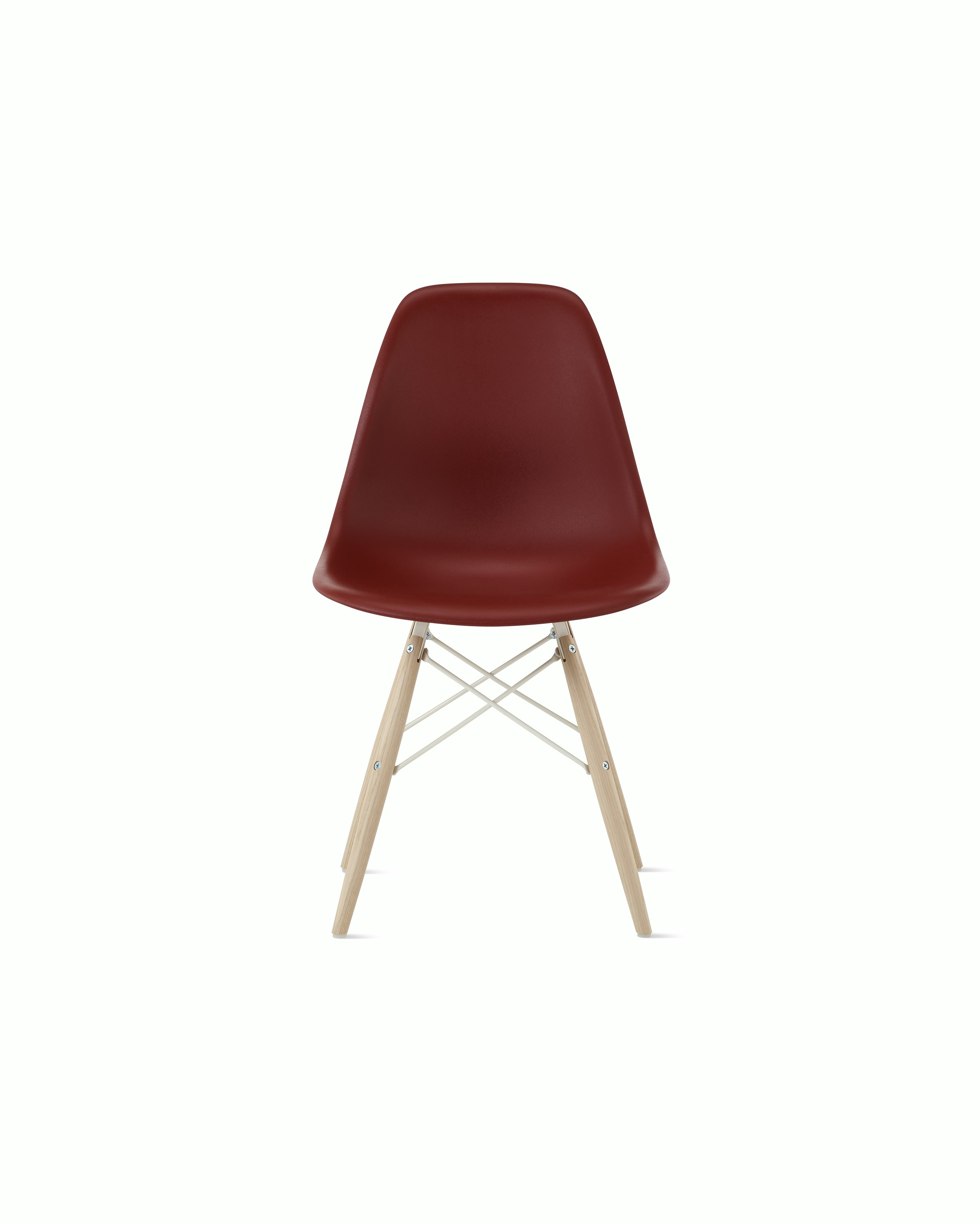 Front of brick red plastic shell chair with dowel base.