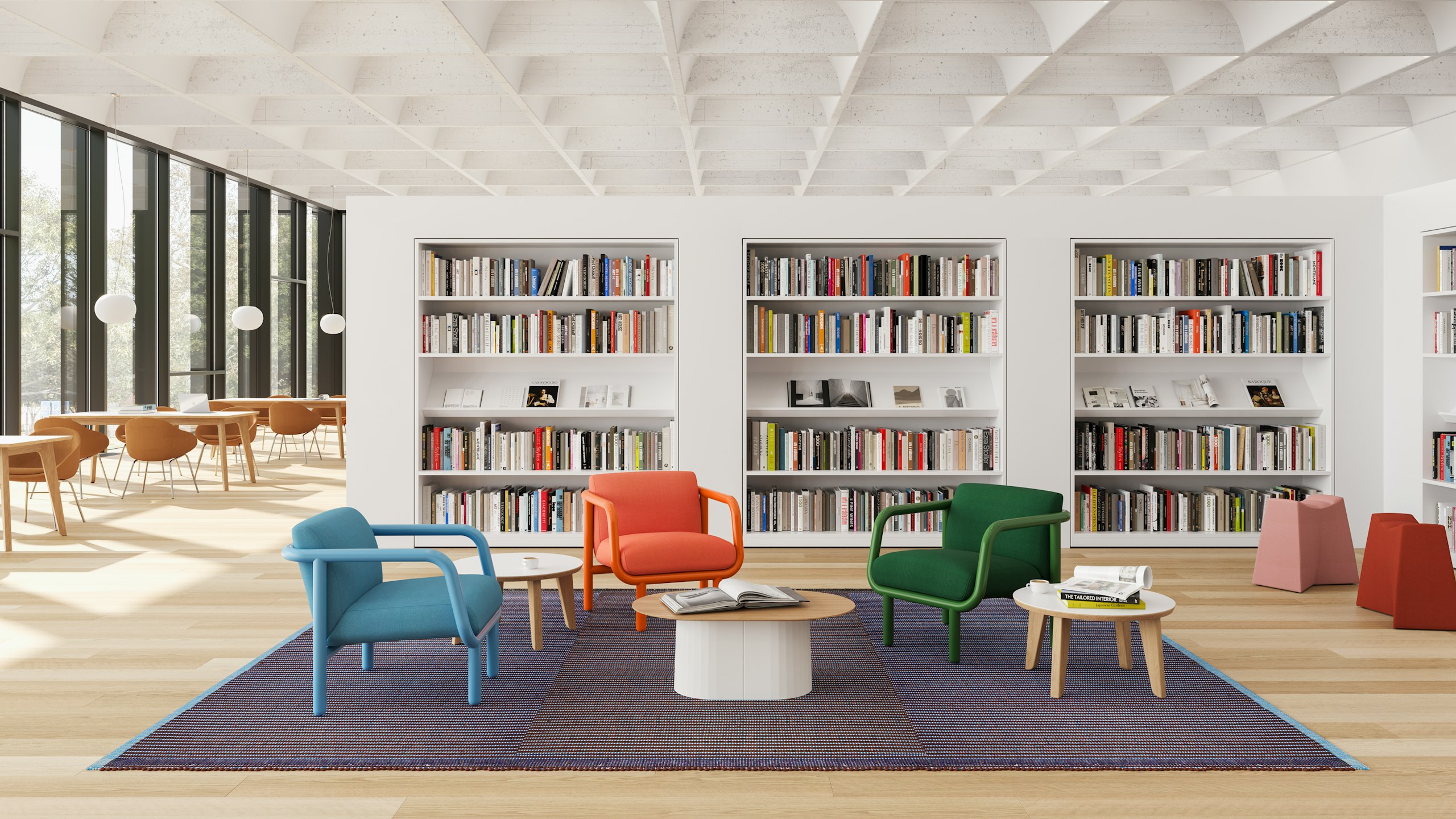 A library setting with three Percy chairs arranged with side tables.