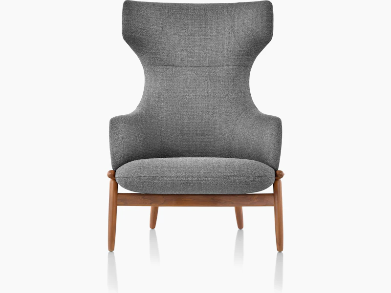 A wing-back Reframe Lounge Chair in Milaner Charcoal, viewed from the front.
