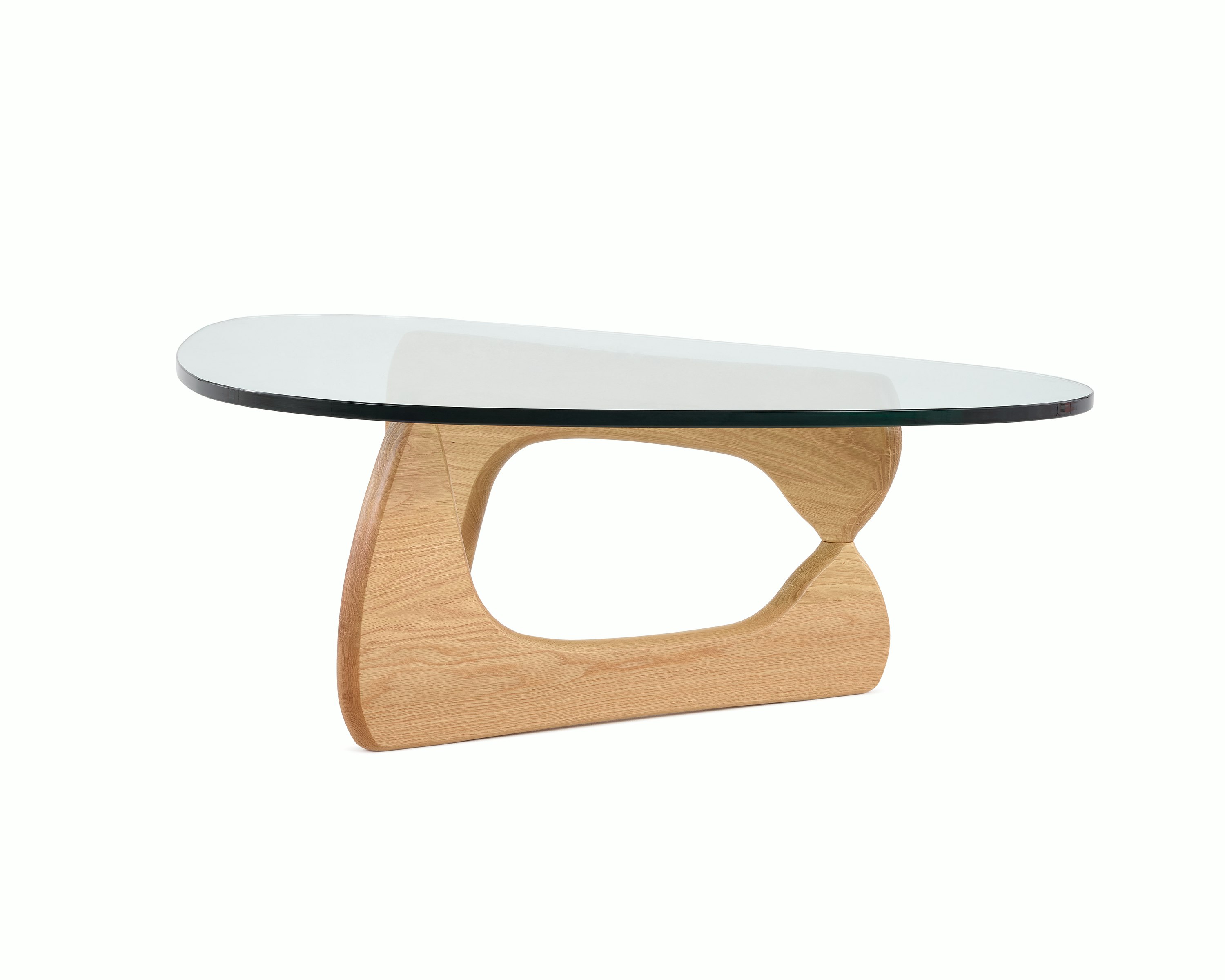 A Noguchi Table with light wood base and glass top.