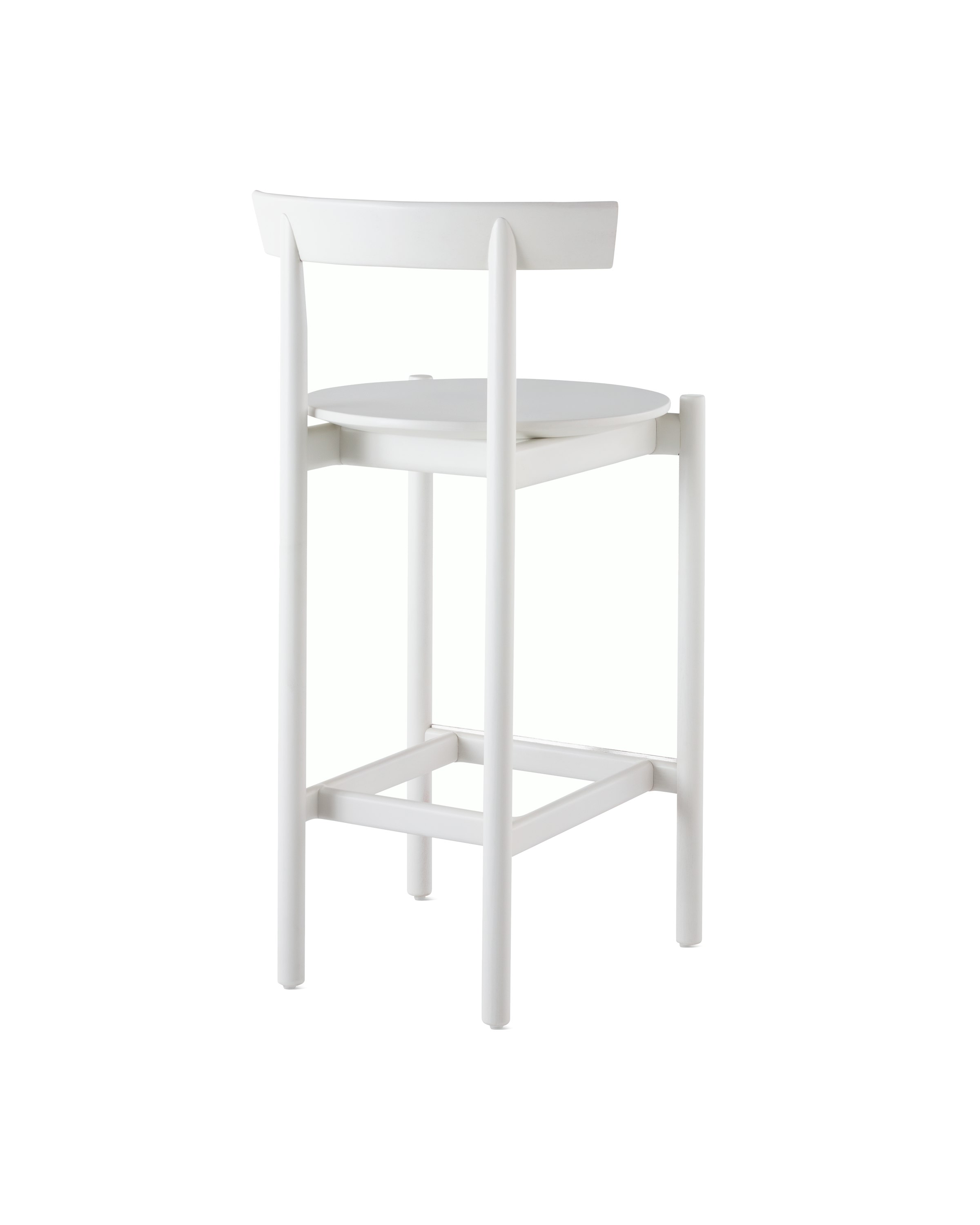 A white counter-height Comma Stool, viewed from the back at an angle. 