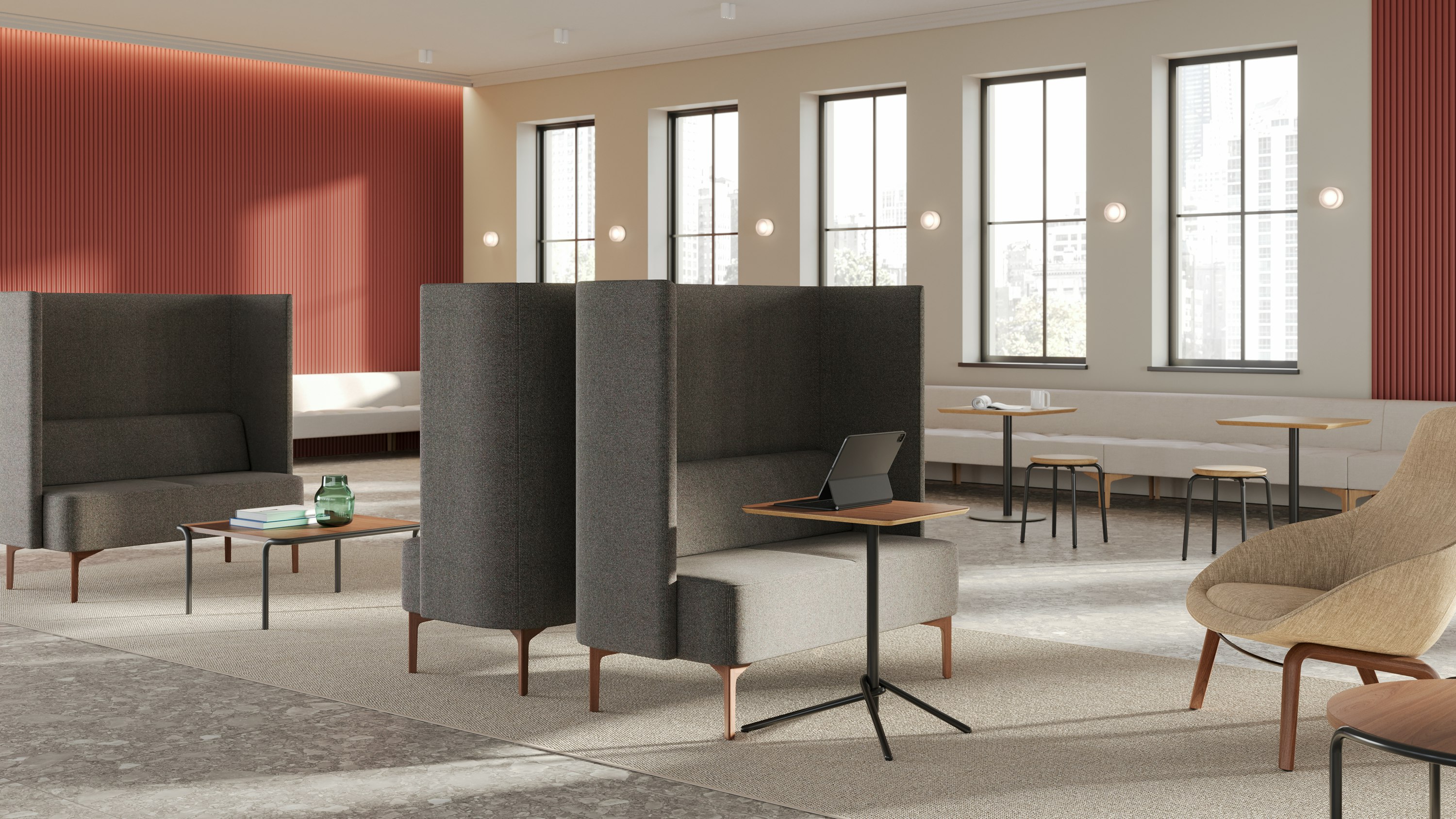 Pullman 2-seat Sofas uphosltered in Maharam Tenebrous in an office setting with Knot Tables, Sweep Coffee Tables and Penny Stools, and an Always Lounge Chair.
