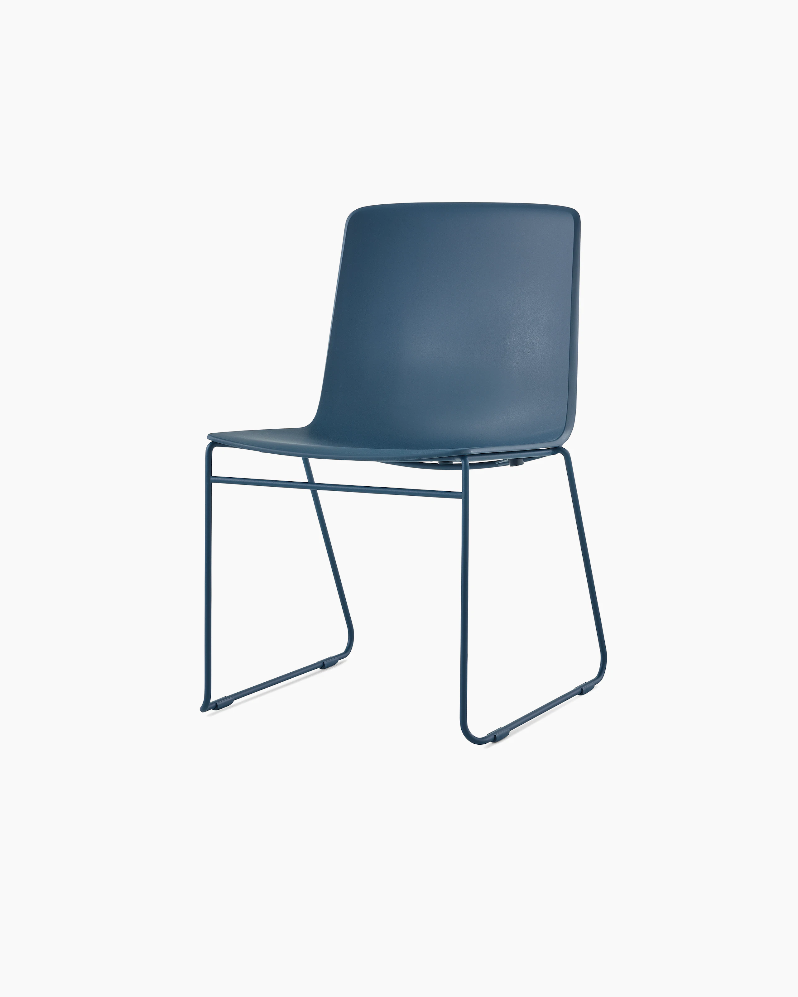 A peacock blue Pronta Stacking Chair with a dipped-in-color shell and base.