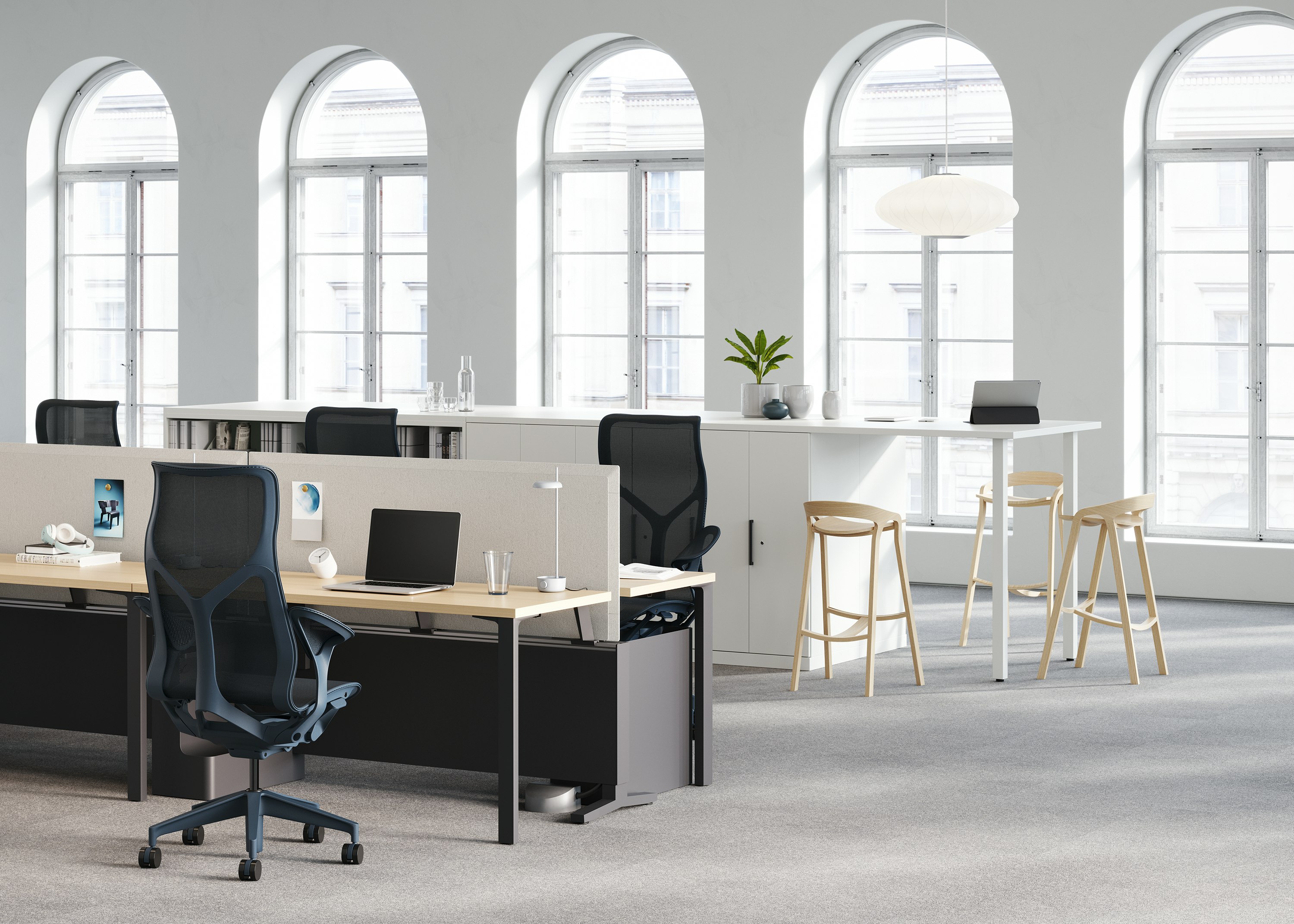 A Canvas Dock workstation, with four high-back Cosm chairs, is a source of power for a Logic Reach round system start.