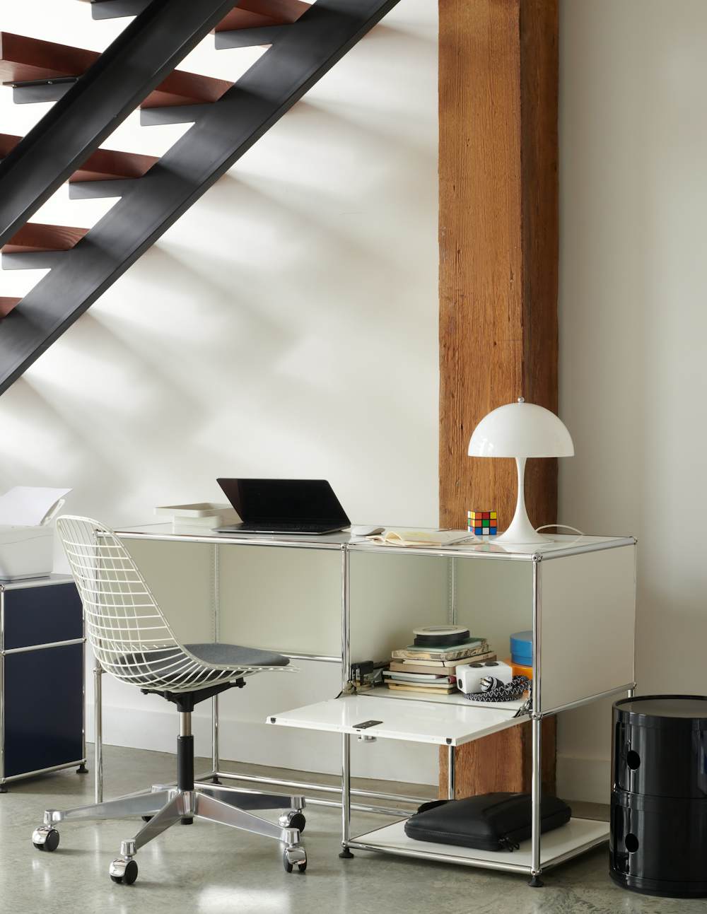 Eames Wire Task Side Chair, USM Haller Desk 1, Panthella Table Lamp and Componibili Storage Unit in a home office setting