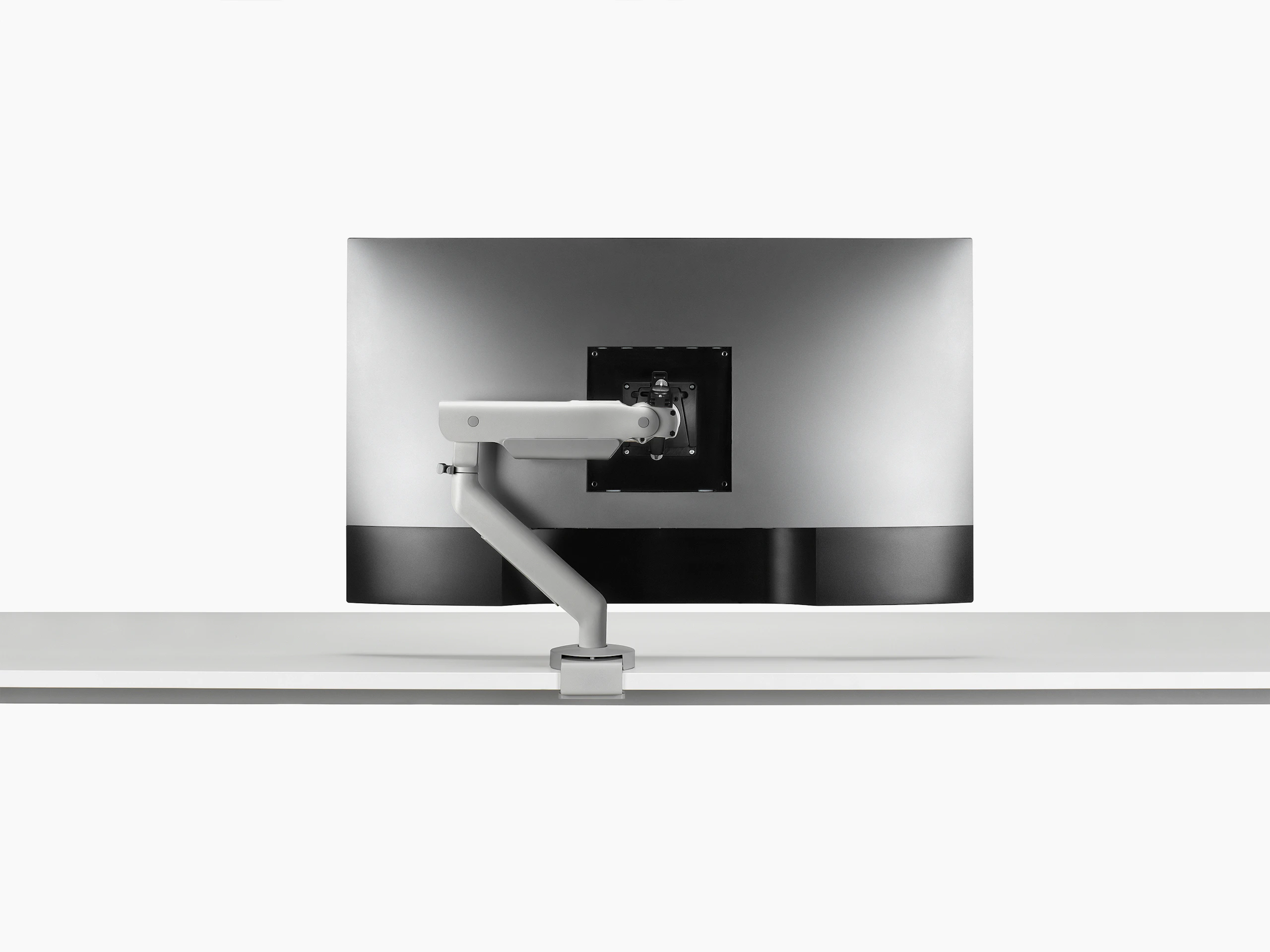 Silver single Flo X arm with a 43'' screen, viewed from the back