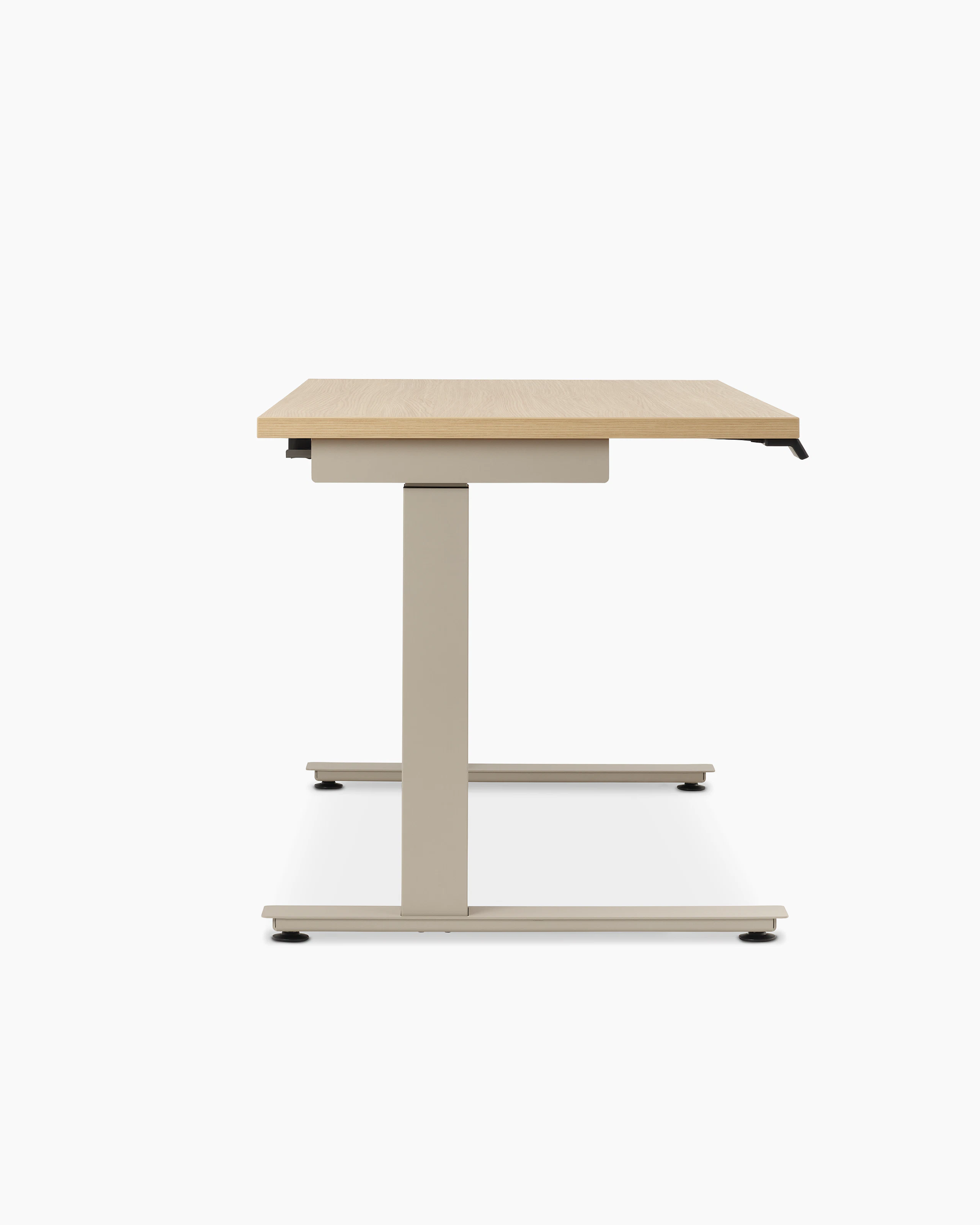 Lev Height Adjustable Table with core laminate warm ash, viewed from the side.