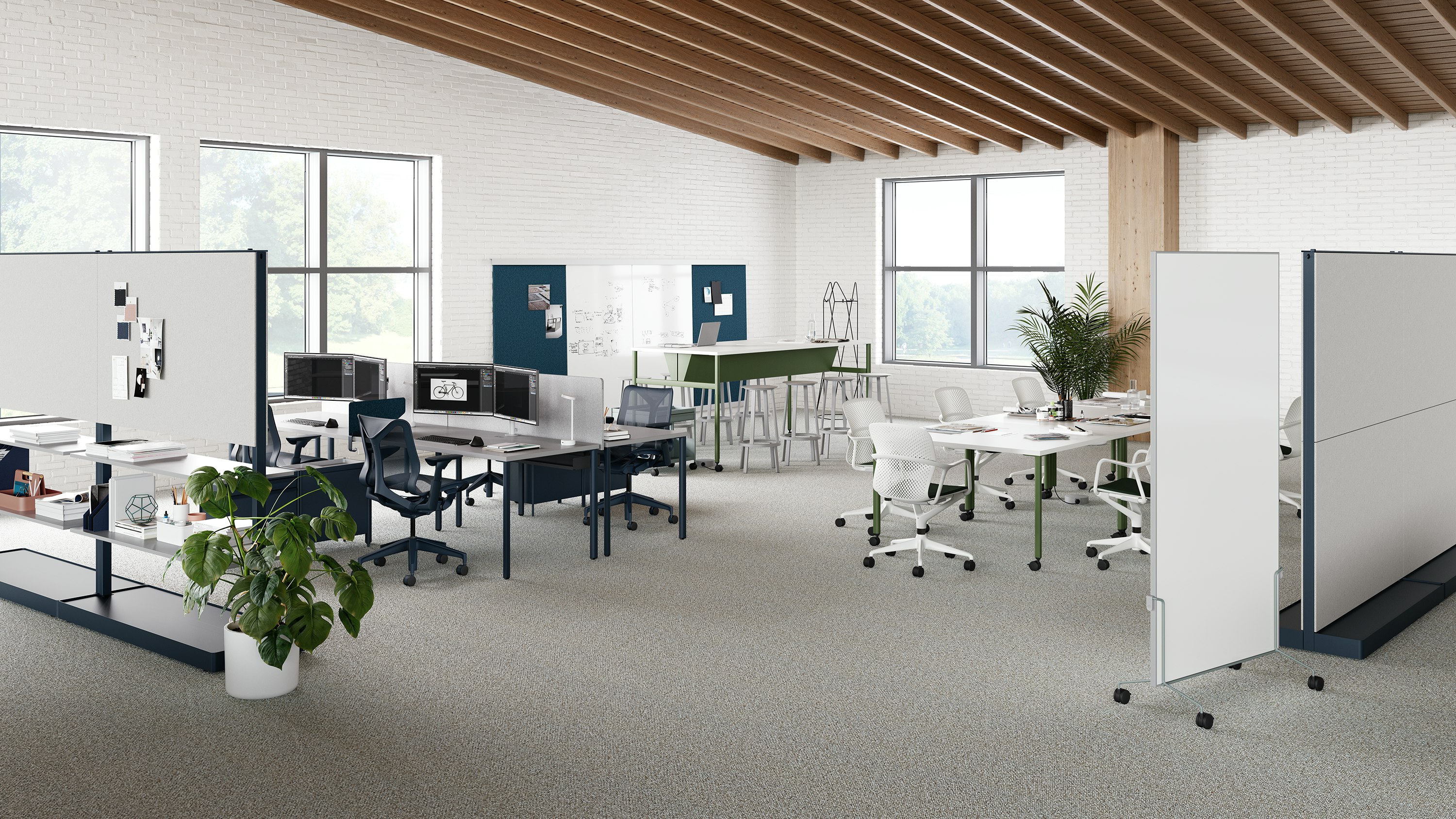 Open floor collaborative space with benching, communal table, project table and movable walls.