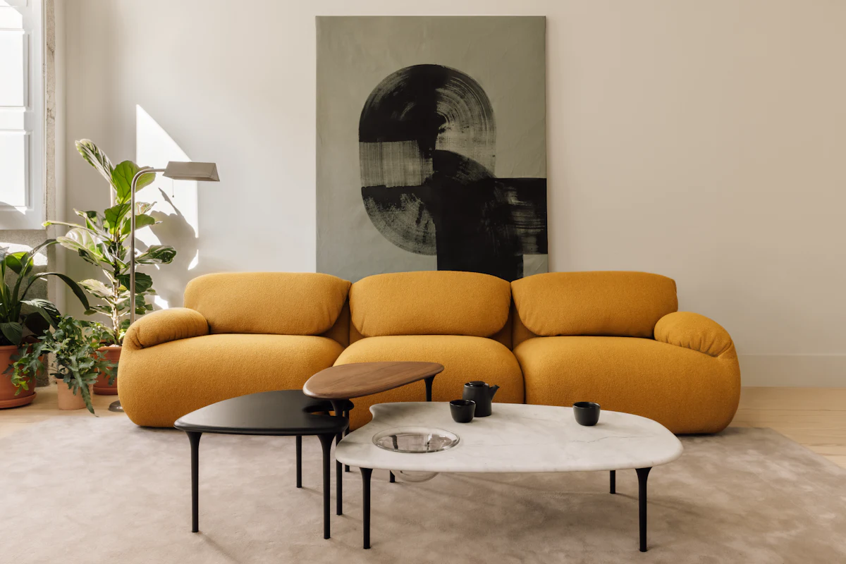 Close-up of a two-seat orange-brown modular sofa with rounded armrests