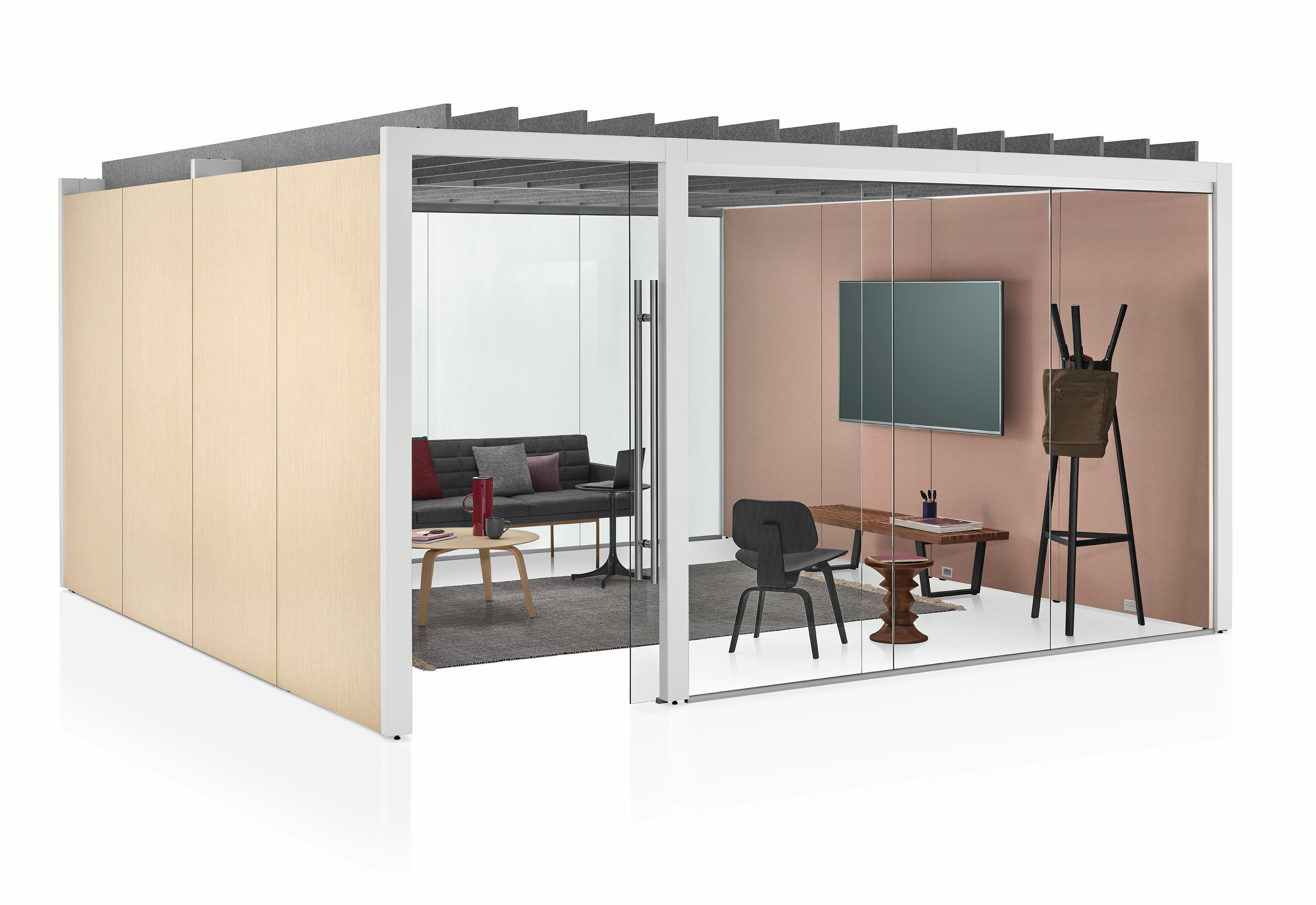 An enclosed Overlay meeting room with two glass walls and two laminate walls. A couch, bench, coat rack, coffee table, and monitor are inside Overlay.