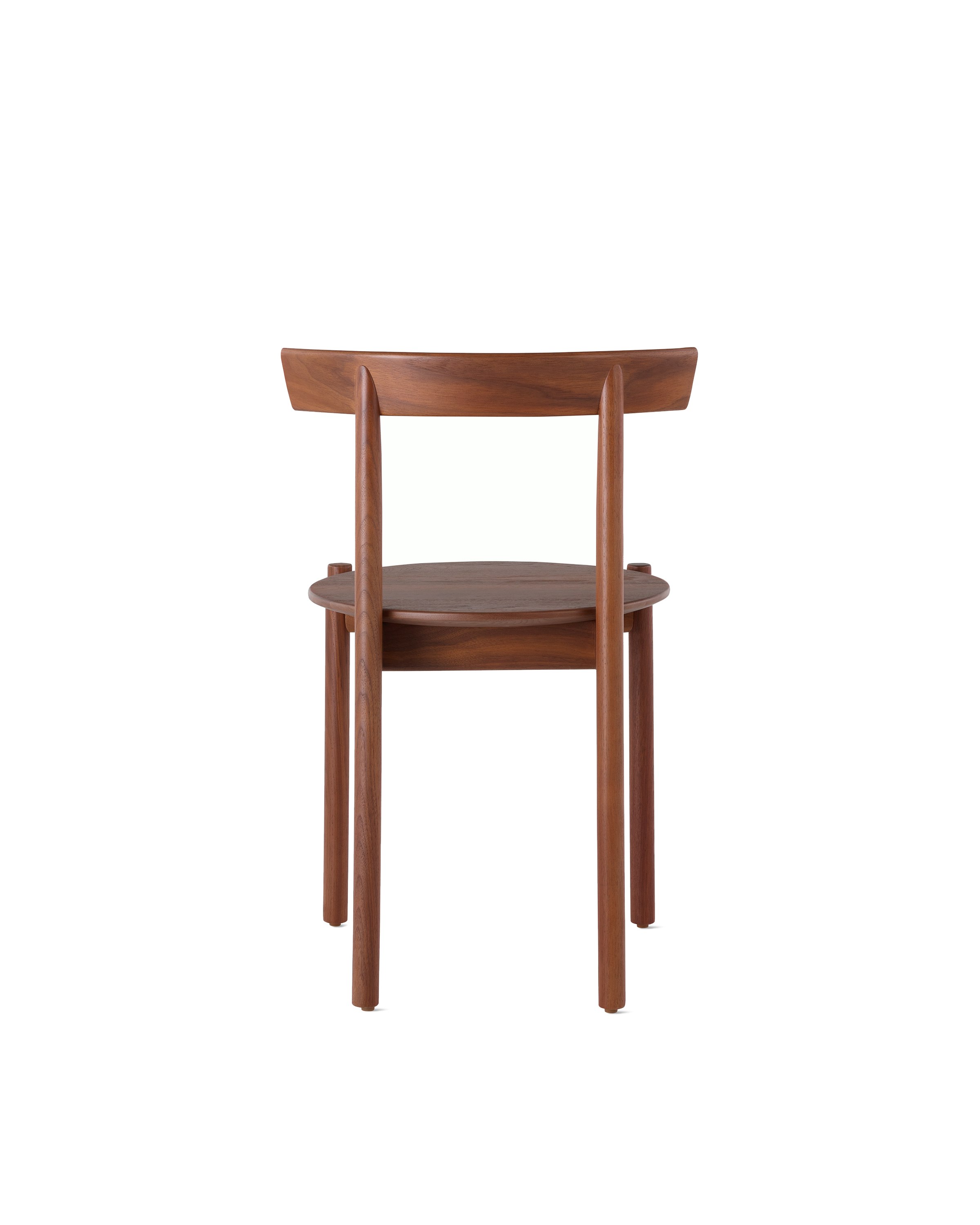 A walnut Comma Chair, viewed from the back.