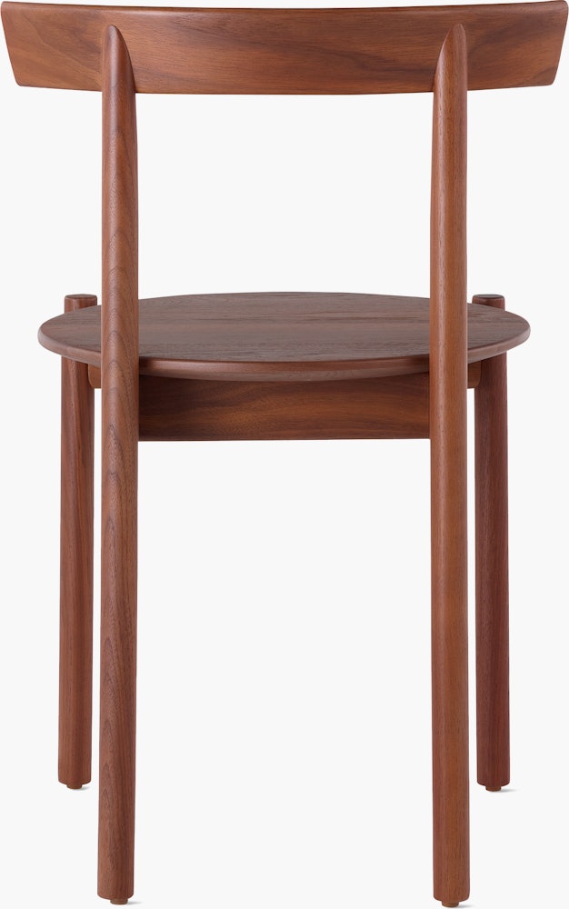 A walnut Comma Chair, viewed from the back.
