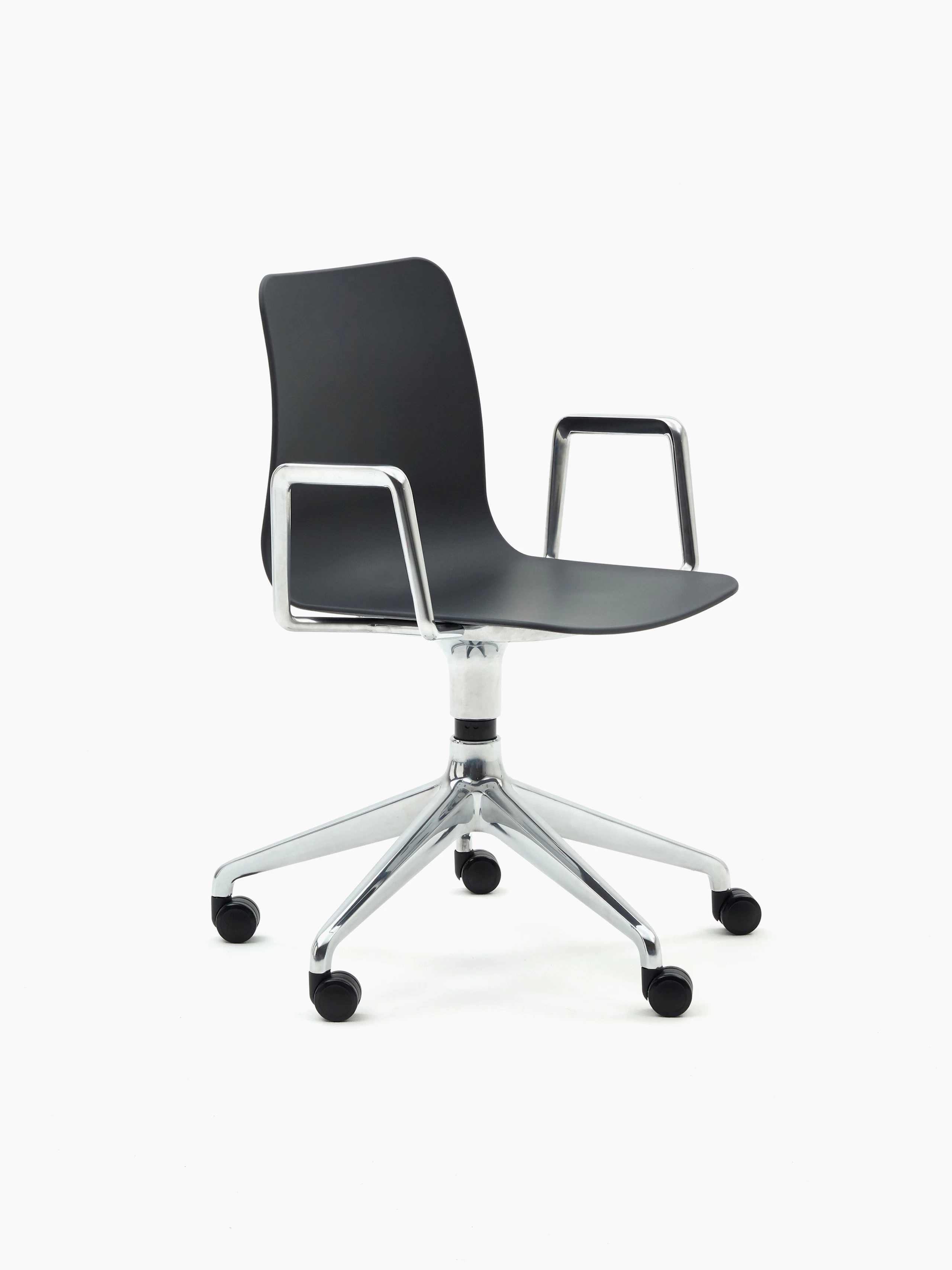 A black naughtone Polly Chair with a 5-star chrome base and armrest.