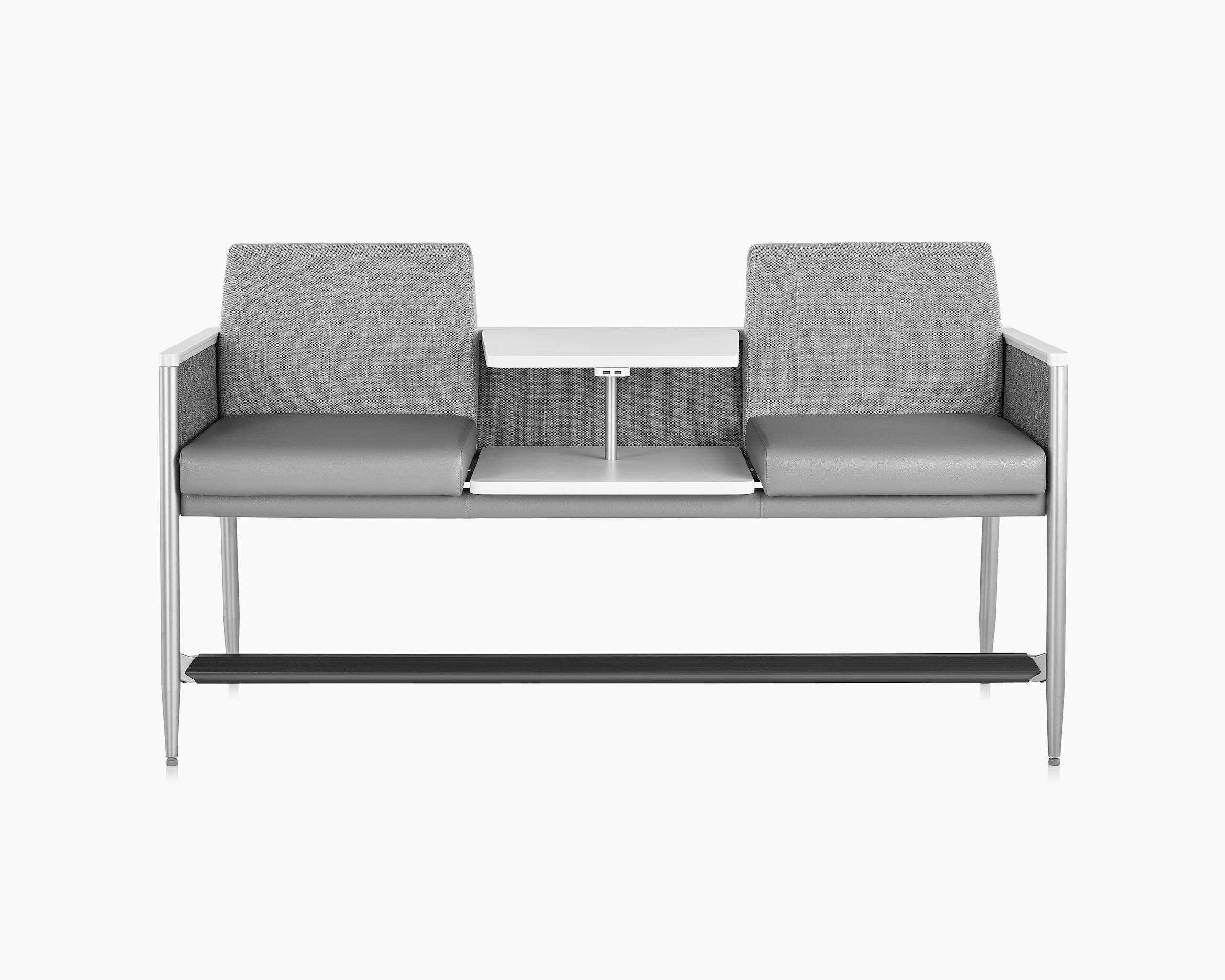 Front view of Palisade Easy Access in a gray upholstery with a height-adjustable center table in white, on white sweep.