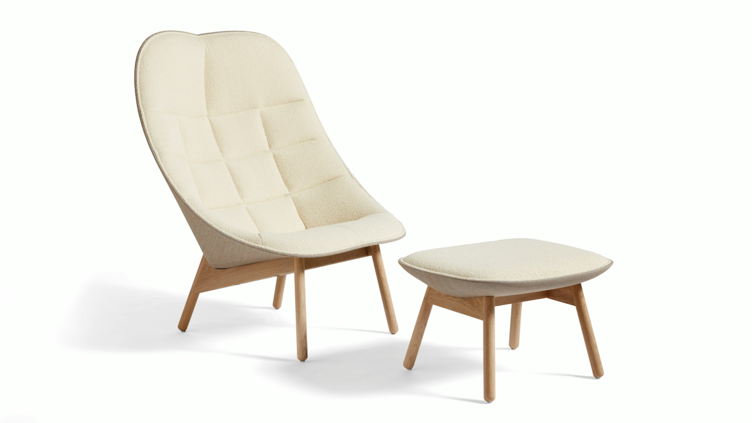 A three-quarter front-view image of an Uchiwa Lounge Chair and Ottoman by Hay