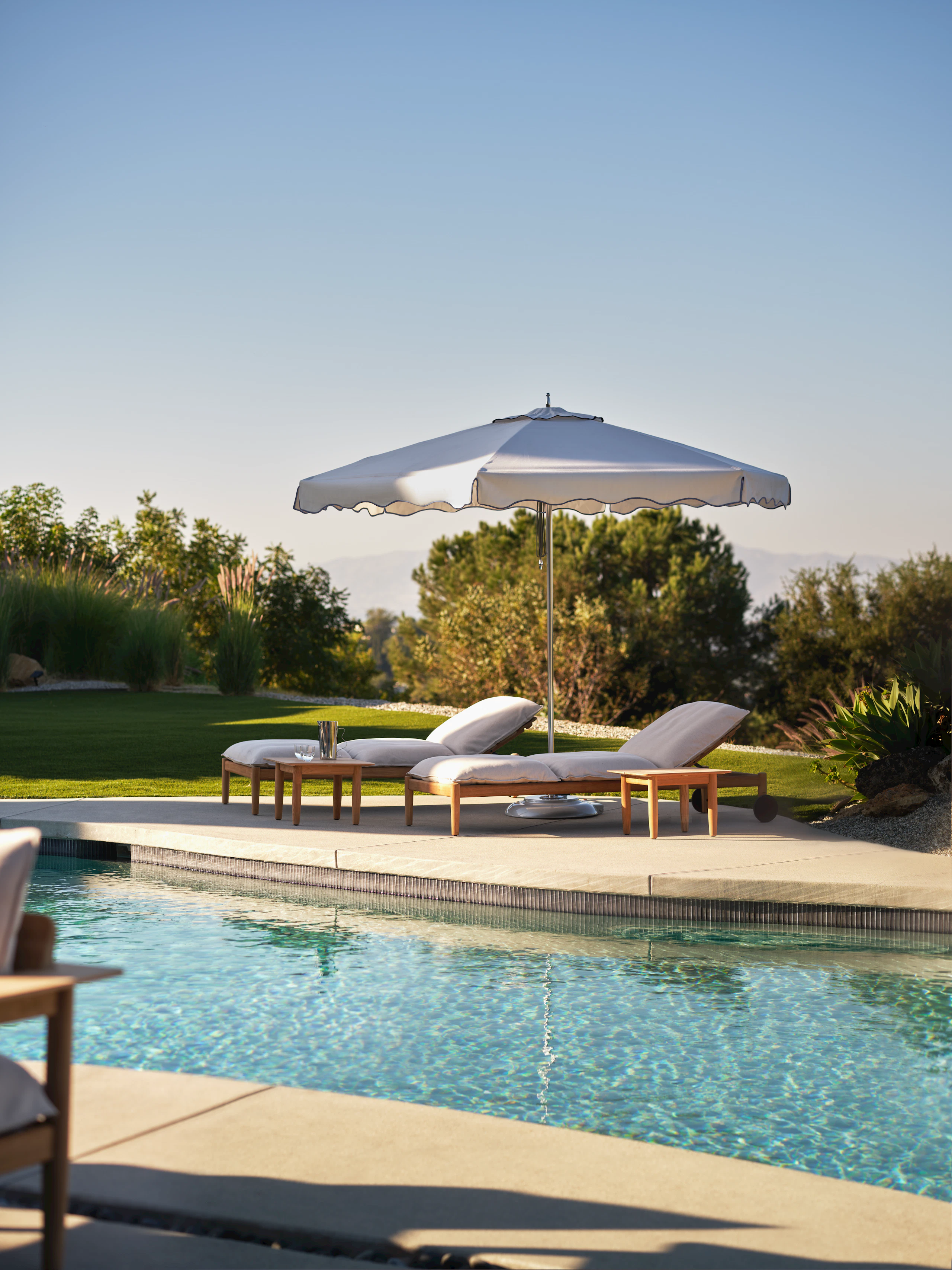 Tuuci Scalloped Umbrella and Terassi Chaise Lounges