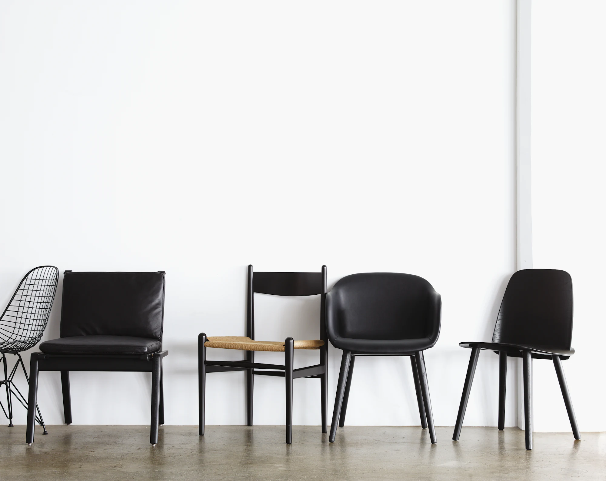 Nerd Chair-style dining chairs in black and other styles shown together.