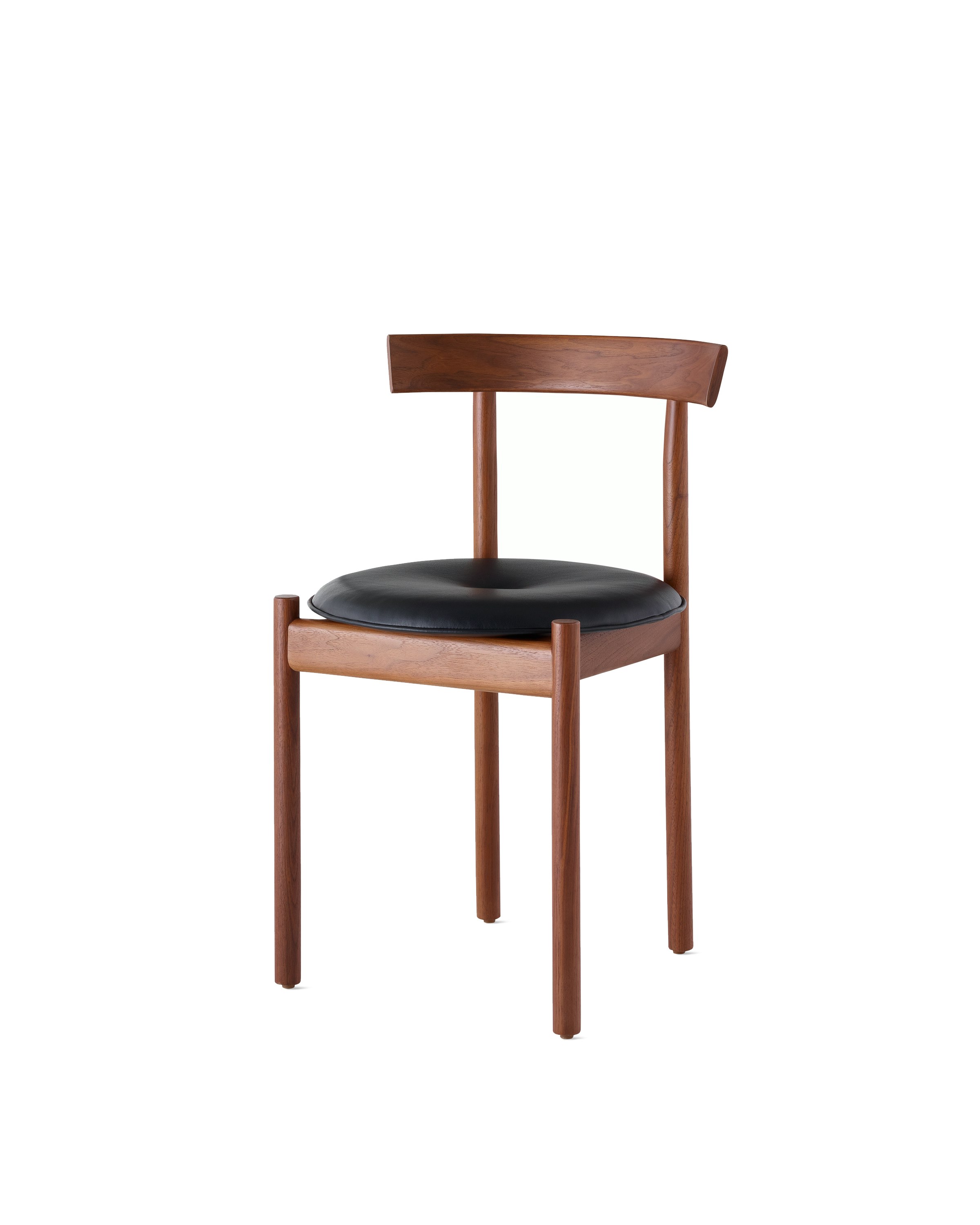 A walnut Comma Chair with a seat pad, viewed from the front at an angle.