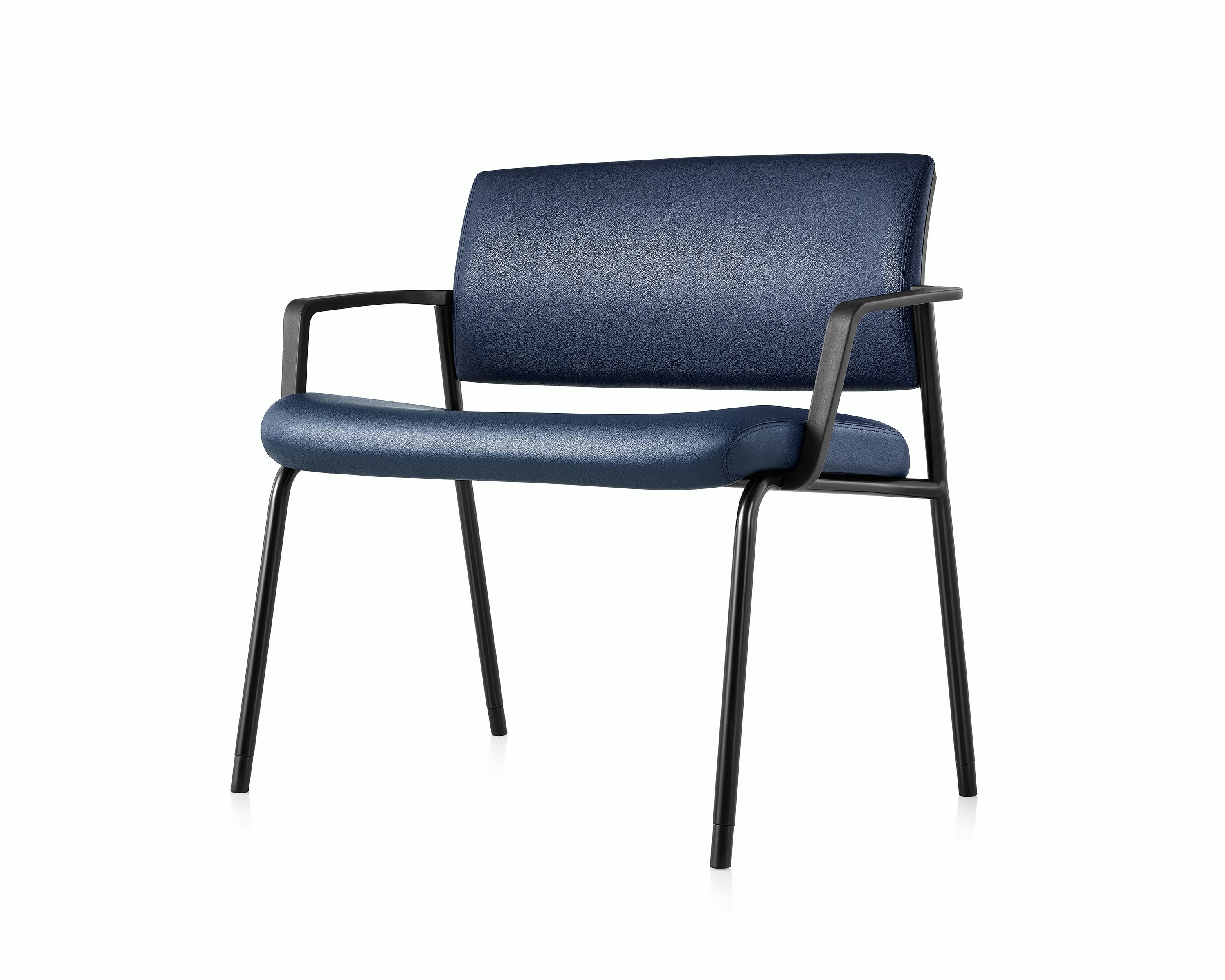 Three quarter, left, view of the Verus Plus Chair with arms, in blue vinyl upholstery.