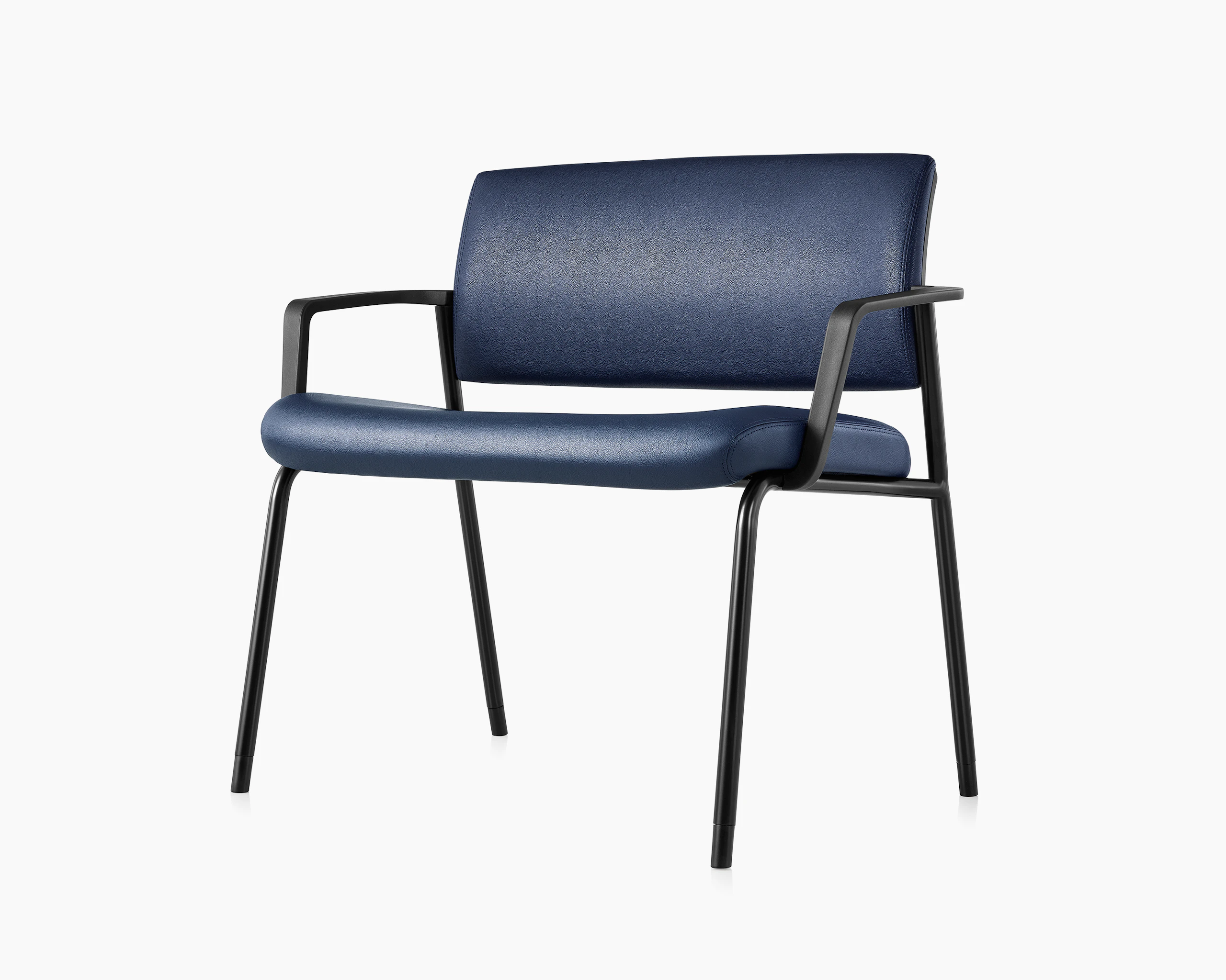 Three quarter, left, view of the Verus Plus Chair with arms, in blue vinyl upholstery.