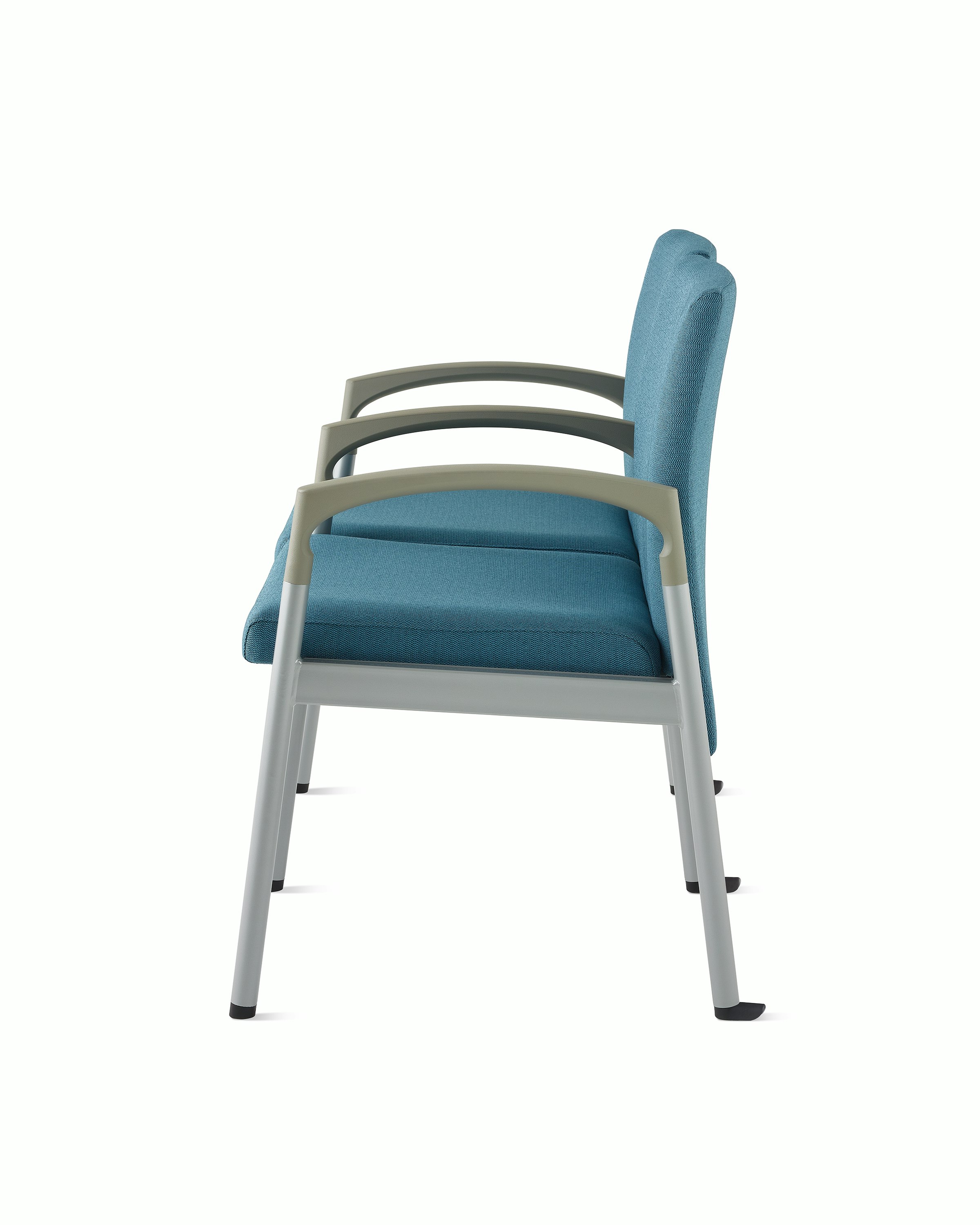 Side view of Valor two-seat multple seating with intervening arms and legs in a blue upholstery, silver frame, and pewter armcaps on white sweep.
