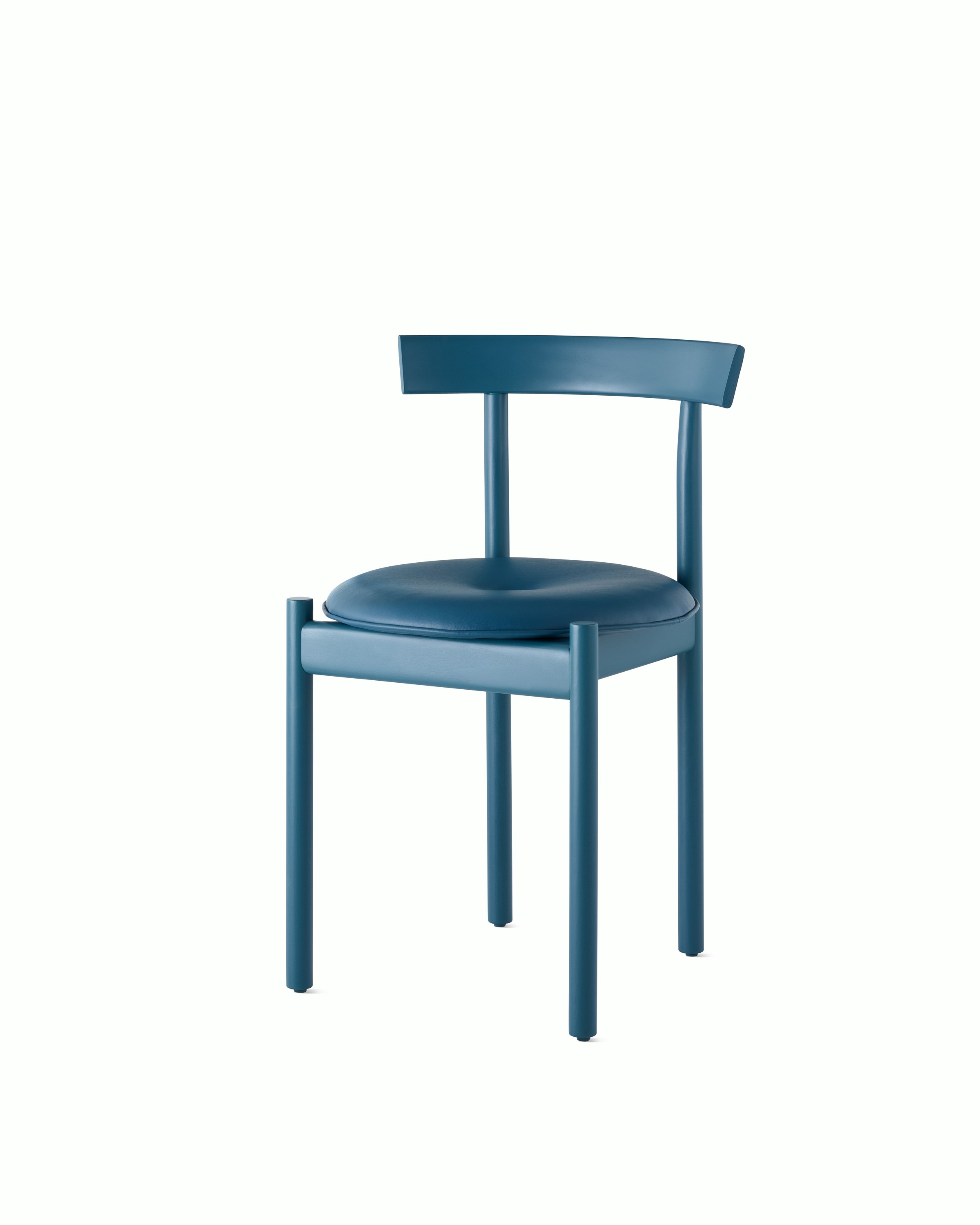 A blue Comma Chair with a seat pad, viewed from the front at an angle.