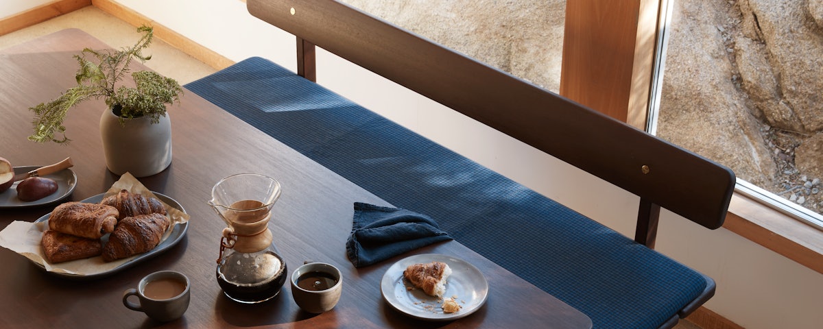 Asserbo Bench, Asserbo Bench Cushion and Asserbo Bench Table in a dining room setting