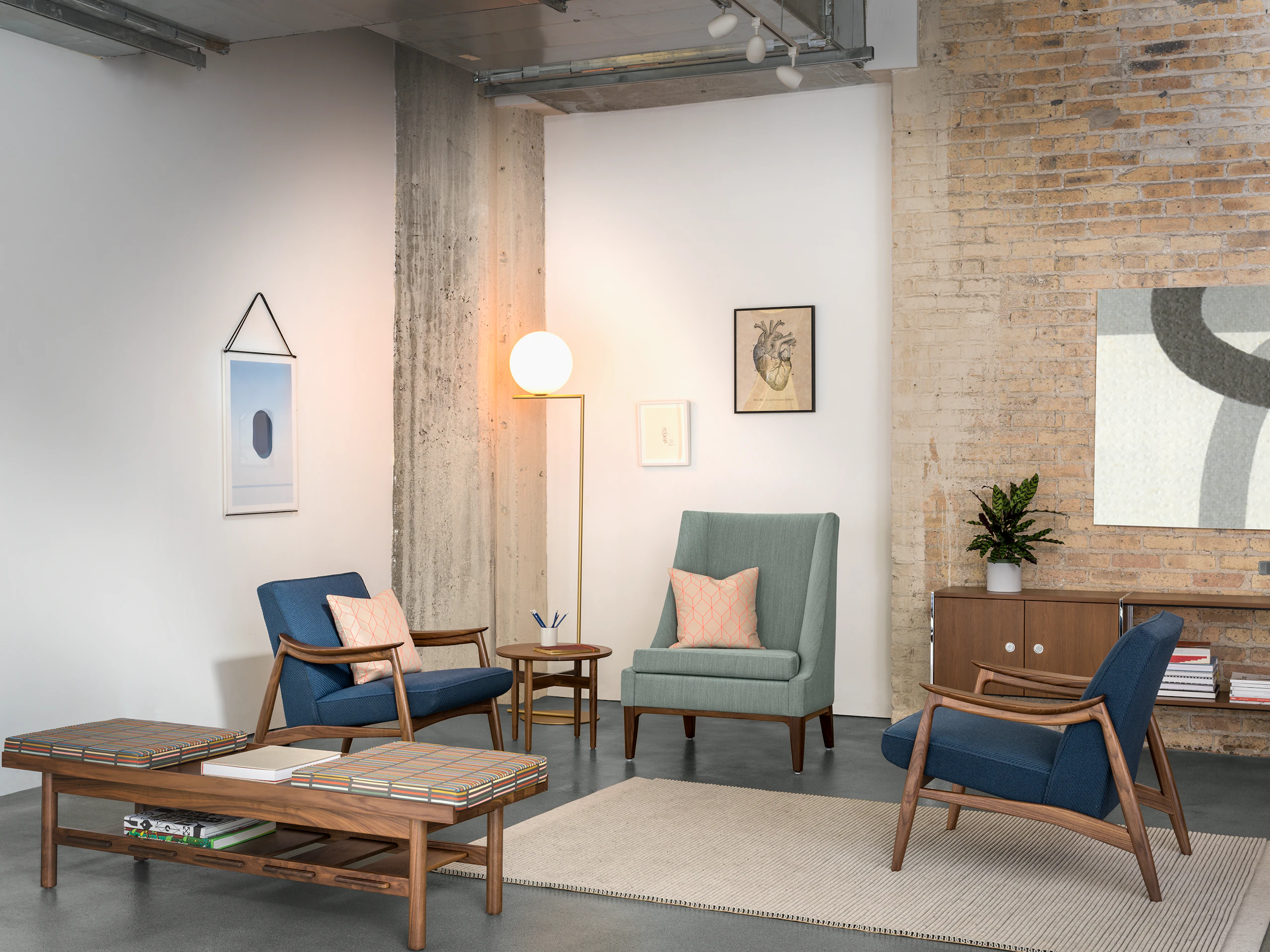 A waiting area featuring two Nemschoff Aspen Lounge Chairs, a Nemschoff Iris Lounge Chair, and a Nemschoff Tamarack Table and Bench.