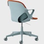 Angle view of Zeph Chair in Glacier with two-toned glacier/cayenne unibody