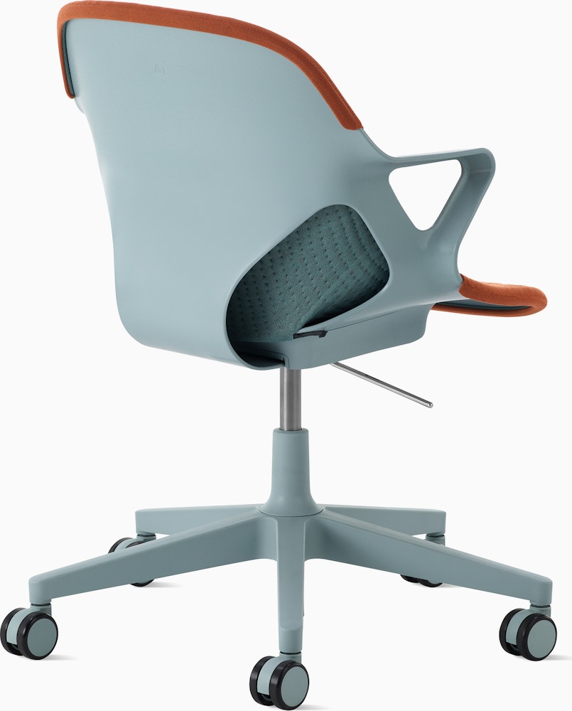Angle view of Zeph Chair in Glacier with two-toned glacier/cayenne unibody