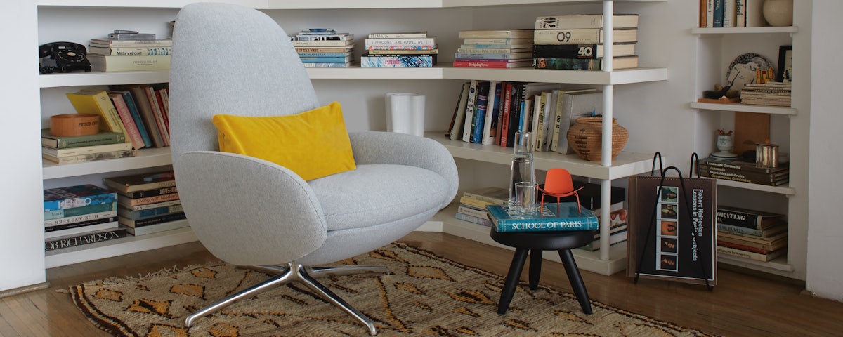 Vala Swivel Recliner in a home library setting