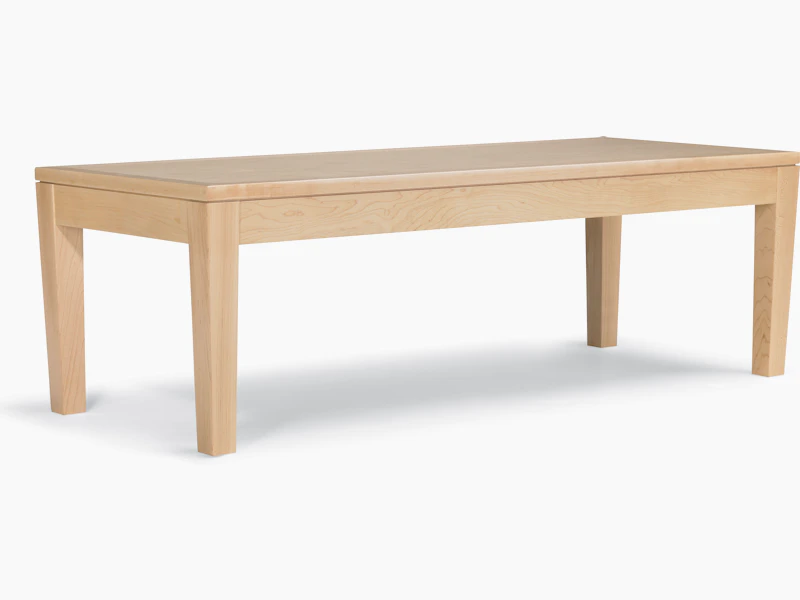 A Brava Table in solid maple with a light finish.