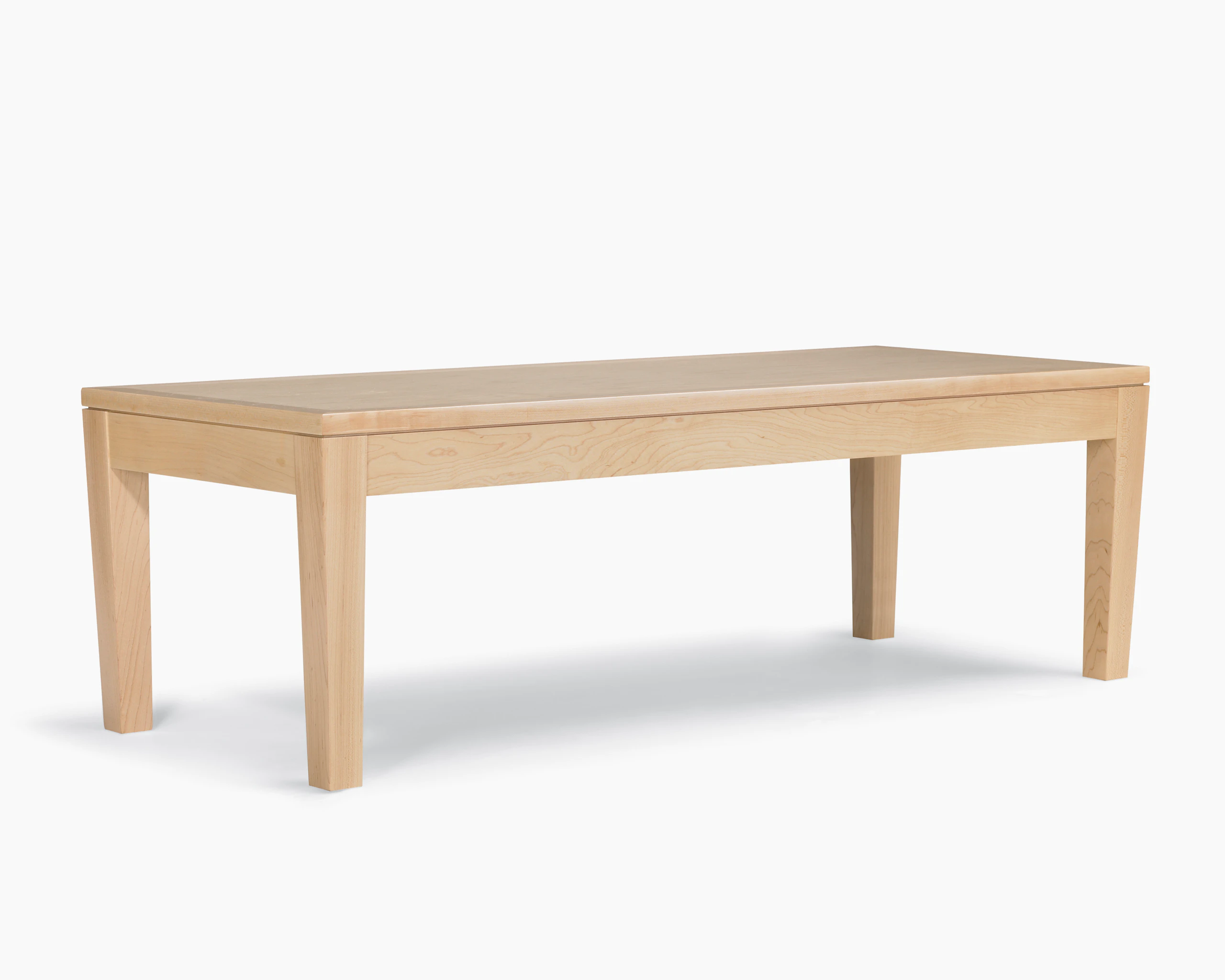 A Brava Table in solid maple with a light finish.