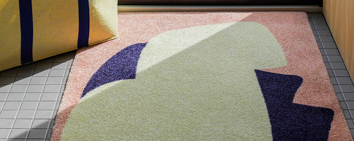 Heymat x Sight Unseen Peach Mat at a home entryway door threshold