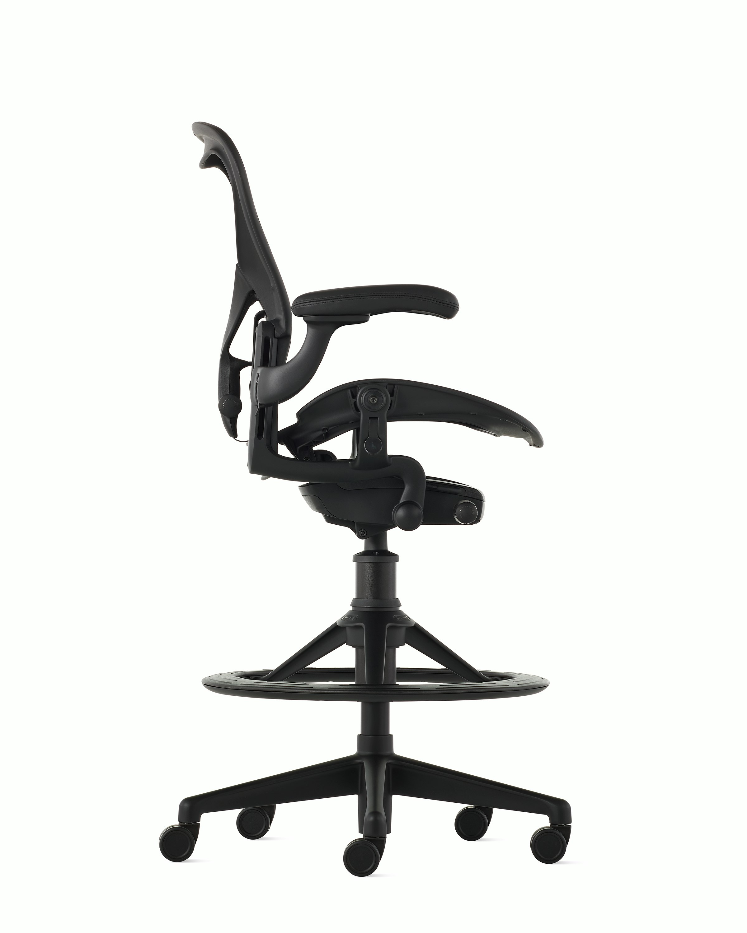 Black matte Aeron Stool on a white background with a 5-star base and ergonomic back support, viewed from the side.