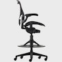 Black matte Aeron Stool on a white background with a 5-star base and ergonomic back support, viewed from the side.