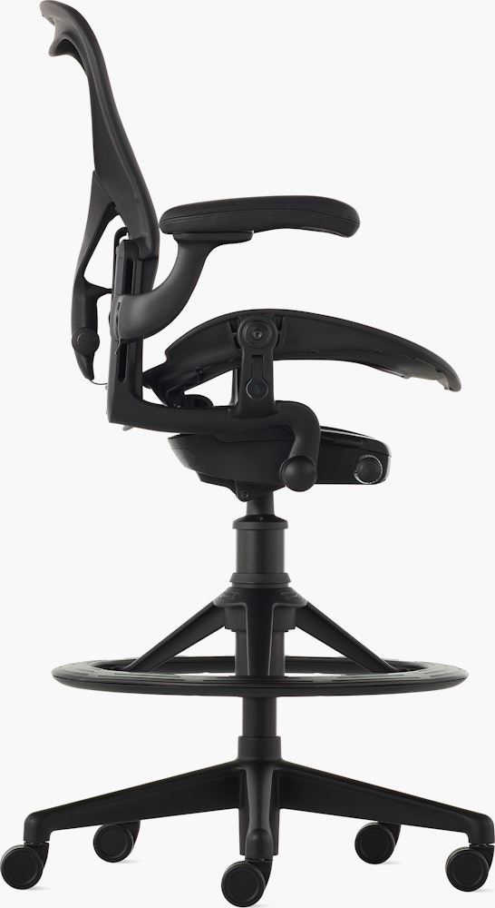 Black matte Aeron Stool on a white background with a 5-star base and ergonomic back support, viewed from the side.