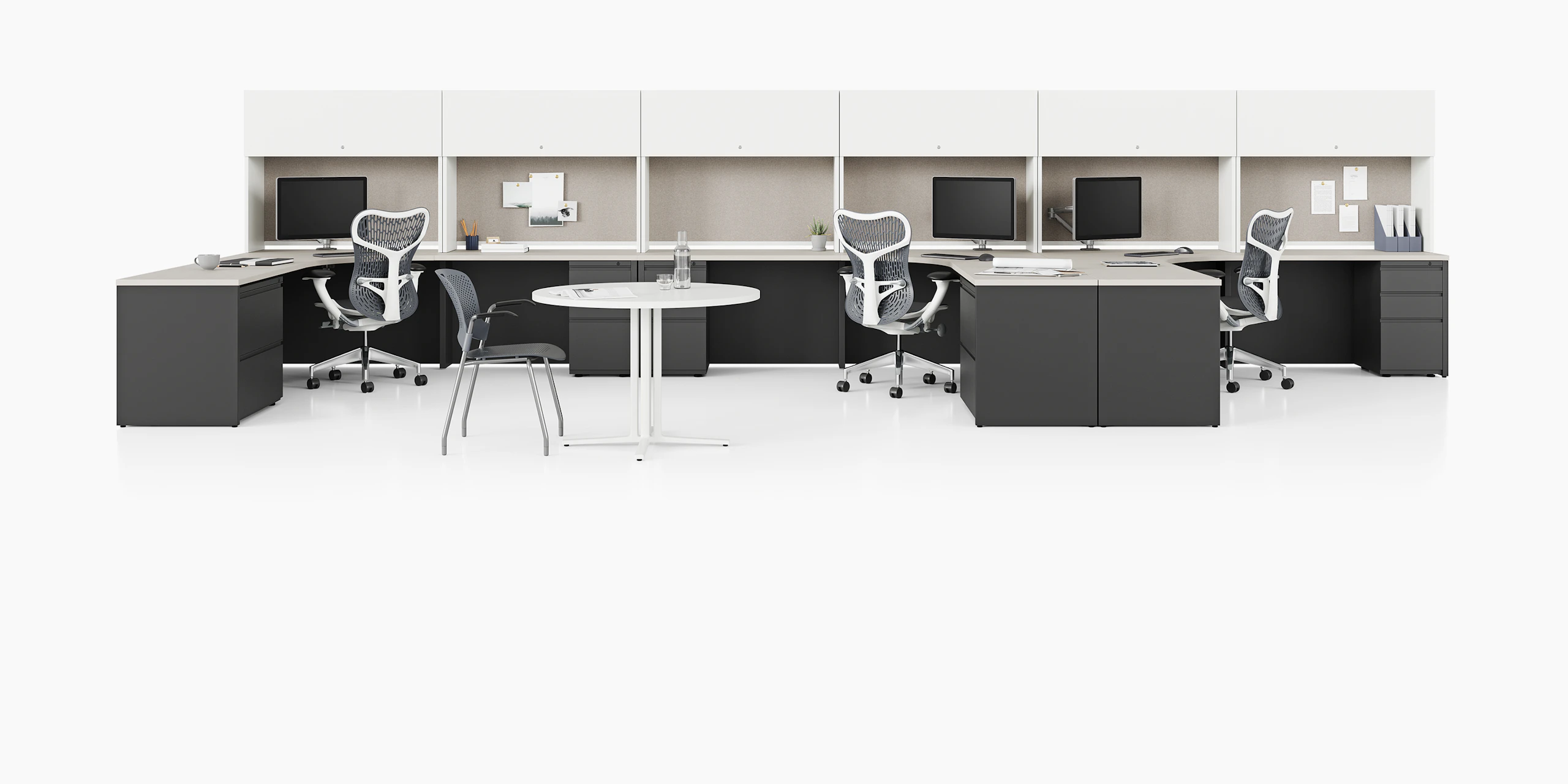 Canvas Metal Desks with dark gray storage units, white upper storage, and tack boards.