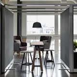 rockwell unscripted creative wall shared walls tall table drink rail counter height easy stools highback chair lounge muuto ambit pendant lamp lighting