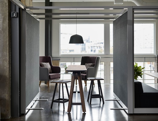 Rockwell Unscripted Creative Wall with Tall Table rockwell unscripted creative wall shared walls tall table drink rail counter height easy stools highback chair lounge muuto ambit pendant lamp lighting