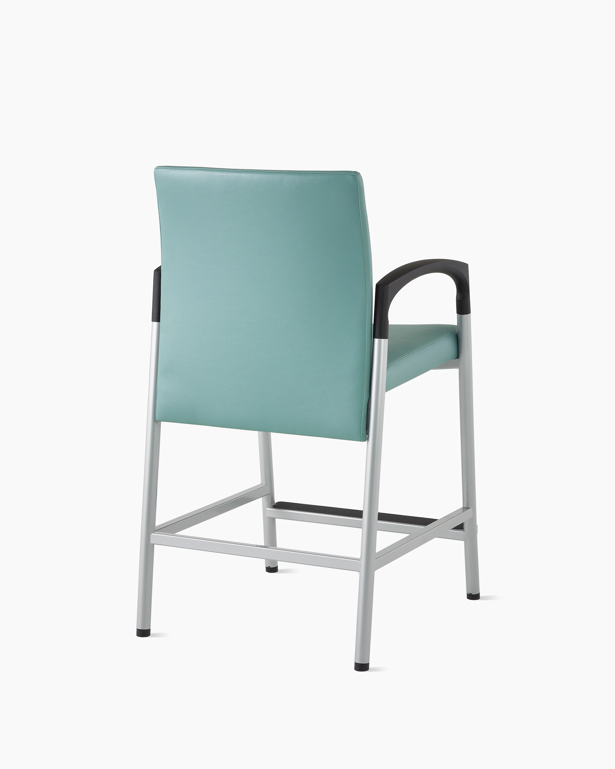 Three-quarter, back view of a Valor Easy Access chair in a blue-green upholstery with a silver frame and black armcaps on white sweep.