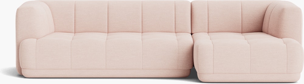 A front view of a light pink Quilton Sectional - Right Chaise.