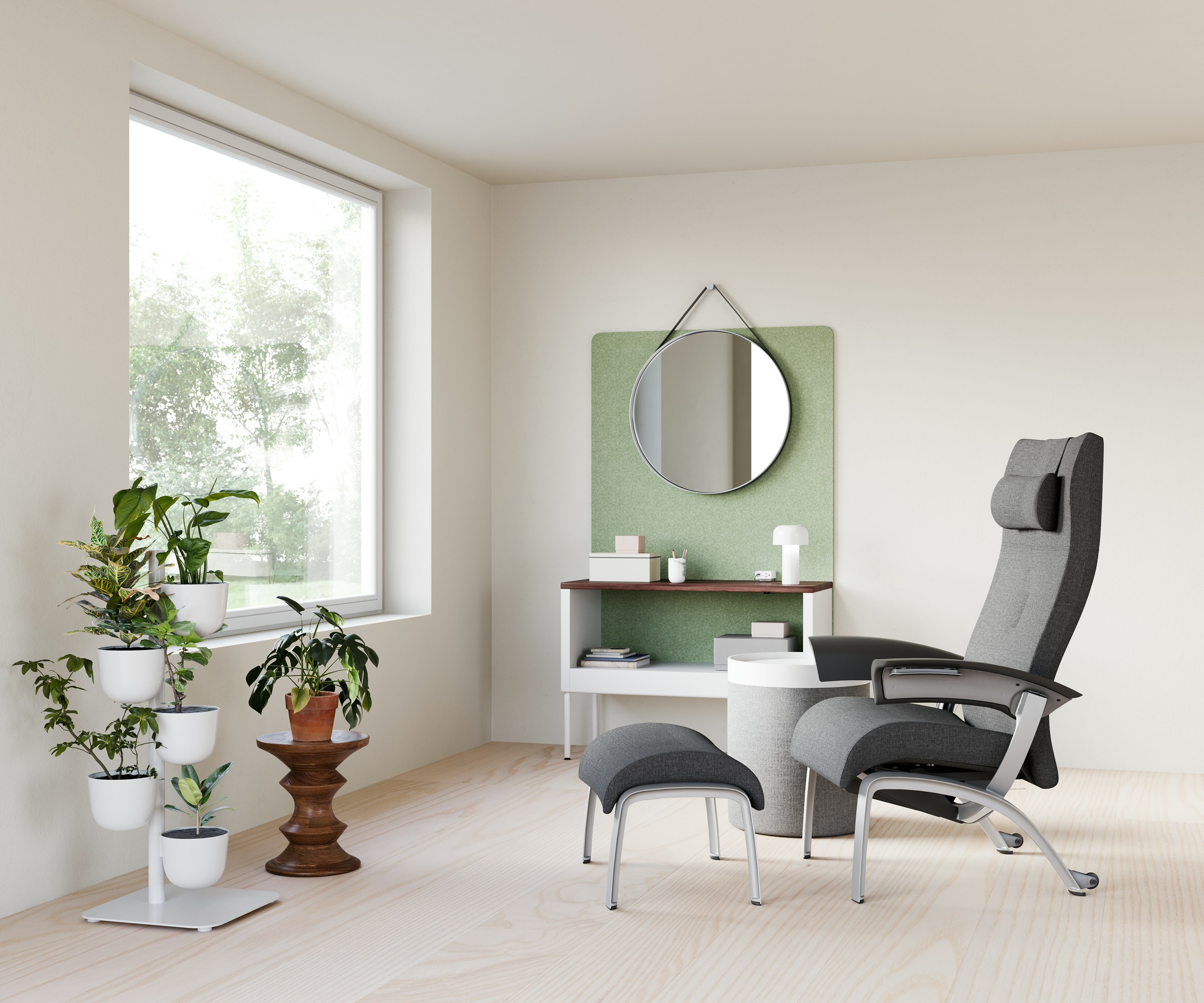 A clinician respite space for one person with a Nemschoff Nala Chair and Ottoman with Public Office Landscape storage bin and screen with a Hay Strap Mirror, with a Eames Walnut Stool, with DWR Drum Pouf and Tray with DWR Story Planter.