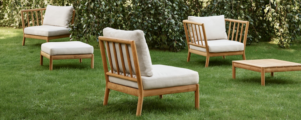 Tradition Outdoor Armless Seat Module in a lawn setting