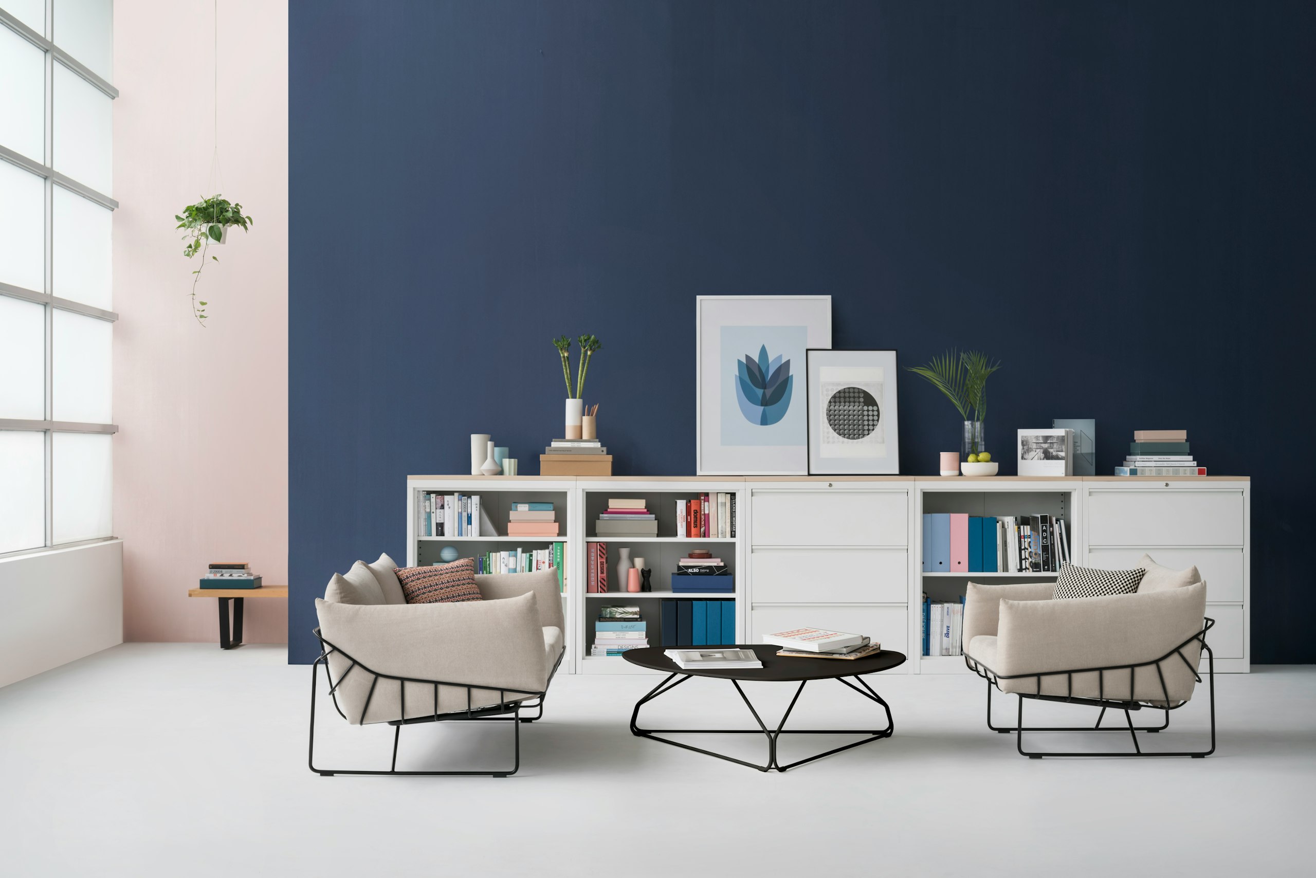 A five-piece configuration of mid-height CK2 Storage units featuring open shelves and lateral filing. A Wireframe Sofa and Polygon Wire Table are in the foreground.