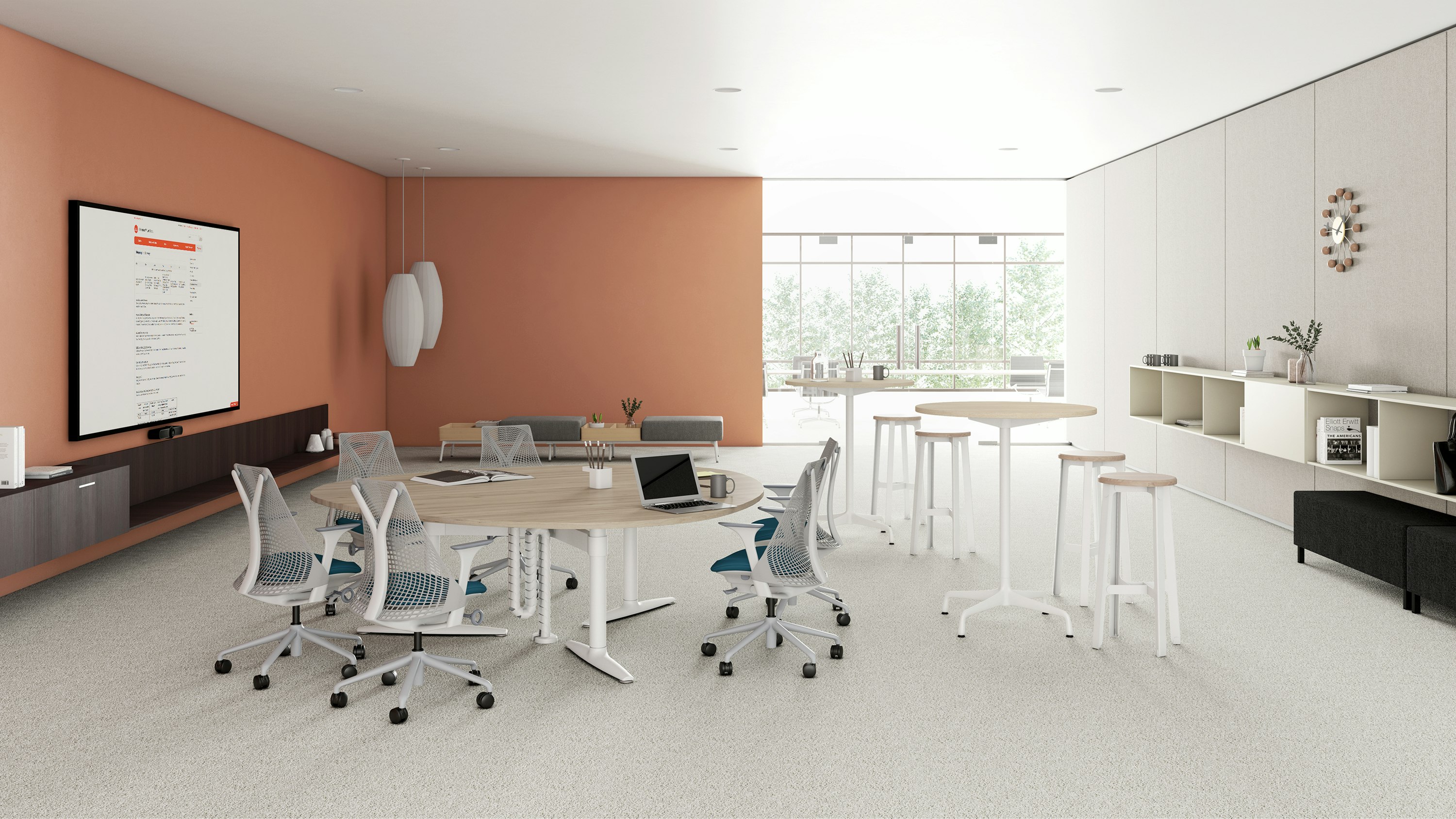 A video conferene collboration space setting featuring a Shift Levels guitar pick table with Sayl Chairs, Sabha Collaborative Seating, Also featuring Nelson Bubble Lamps and Construct Stools.