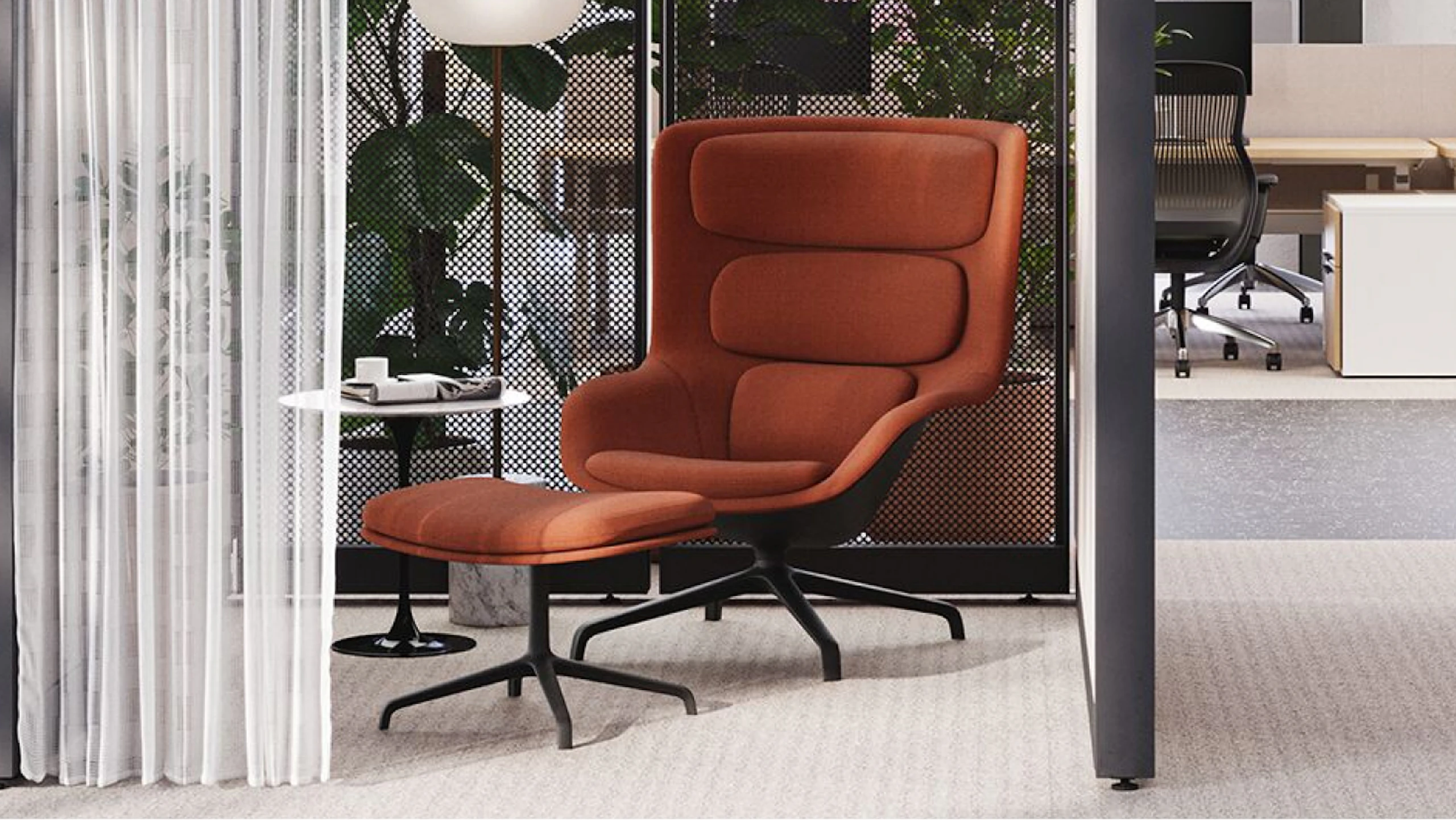 A burnt-orange lounge chair next to a black and white Knoll Saarinen side table in an individual respite space created using Knoll Rockwell Unscripted Creative Walls