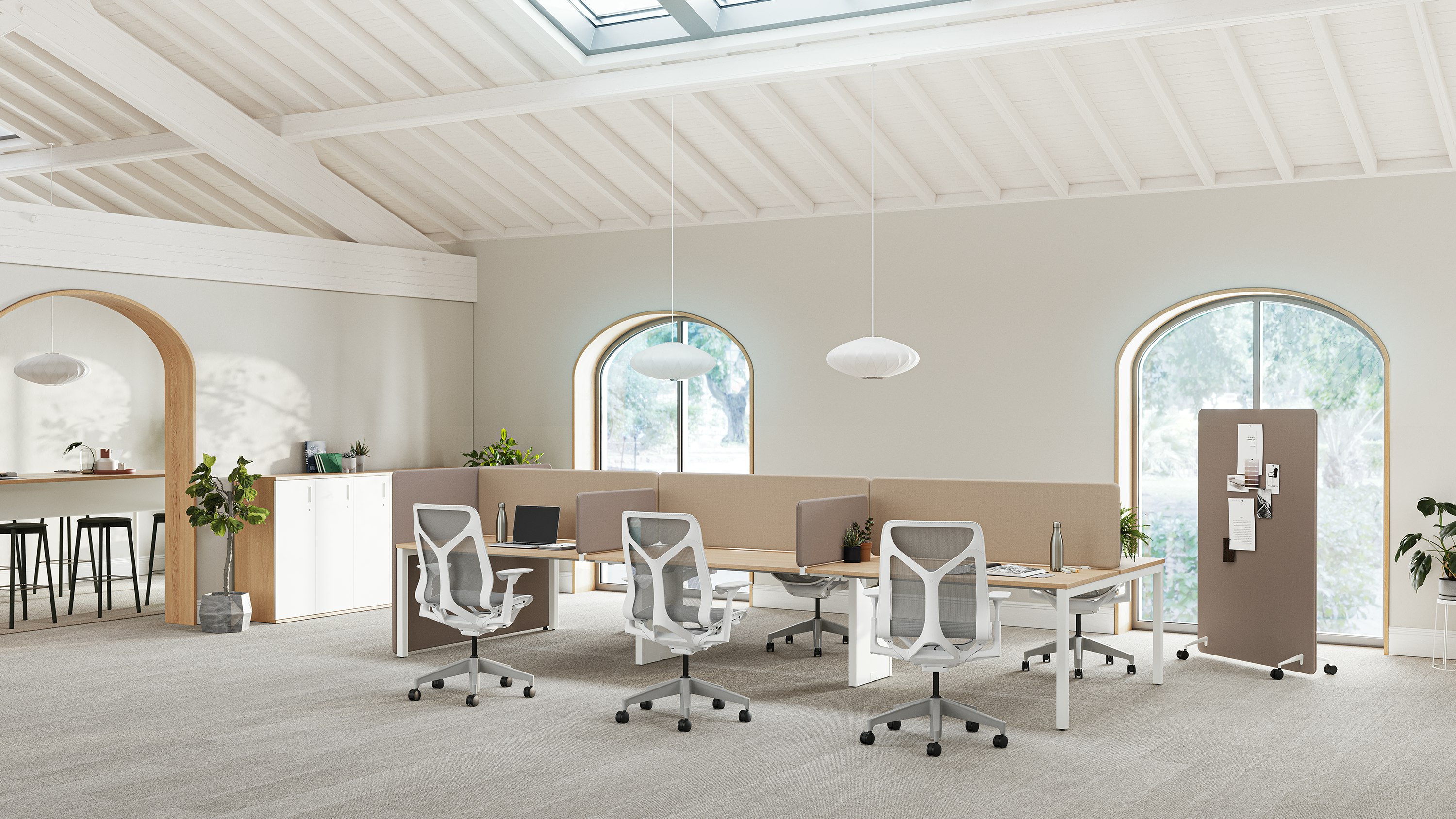 A bright office space with Layout Studio workstations with brown Bound Screens, Cosm Chairs and a brown Bound Mobile Screen in the background.